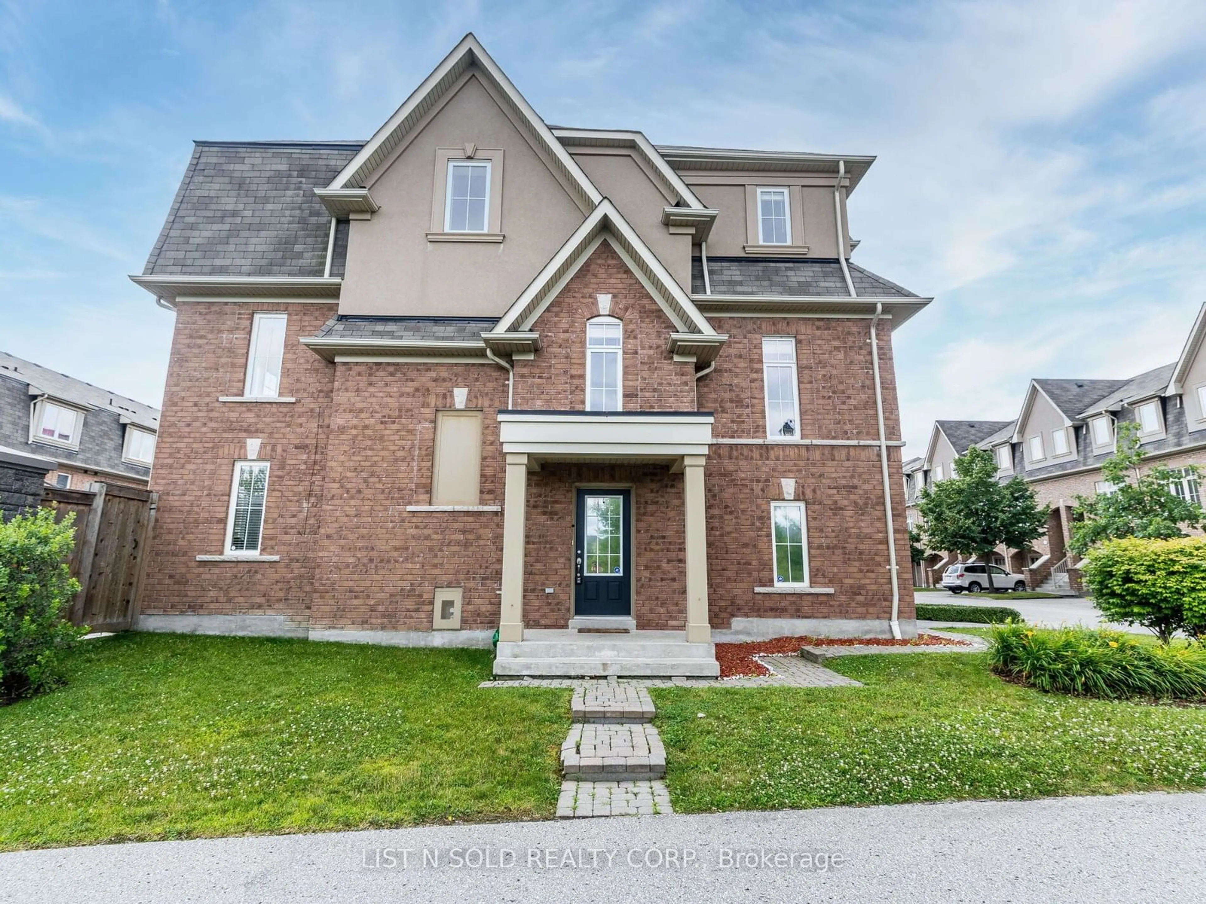 Home with brick exterior material for 1 Burtonbury Lane #61, Ajax Ontario L1Z 0C2