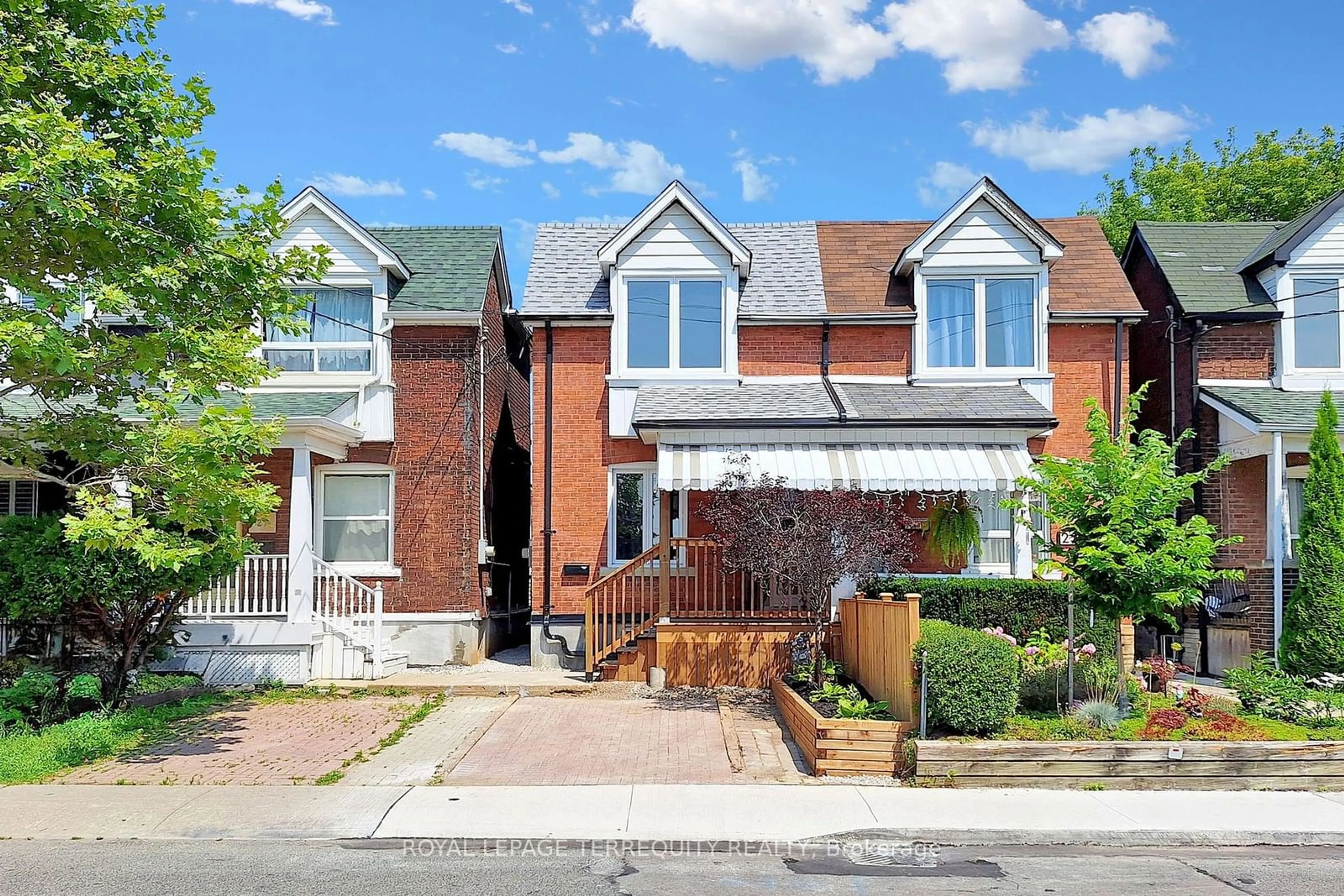 Home with brick exterior material for 25 Sibley Ave, Toronto Ontario M4C 5E8