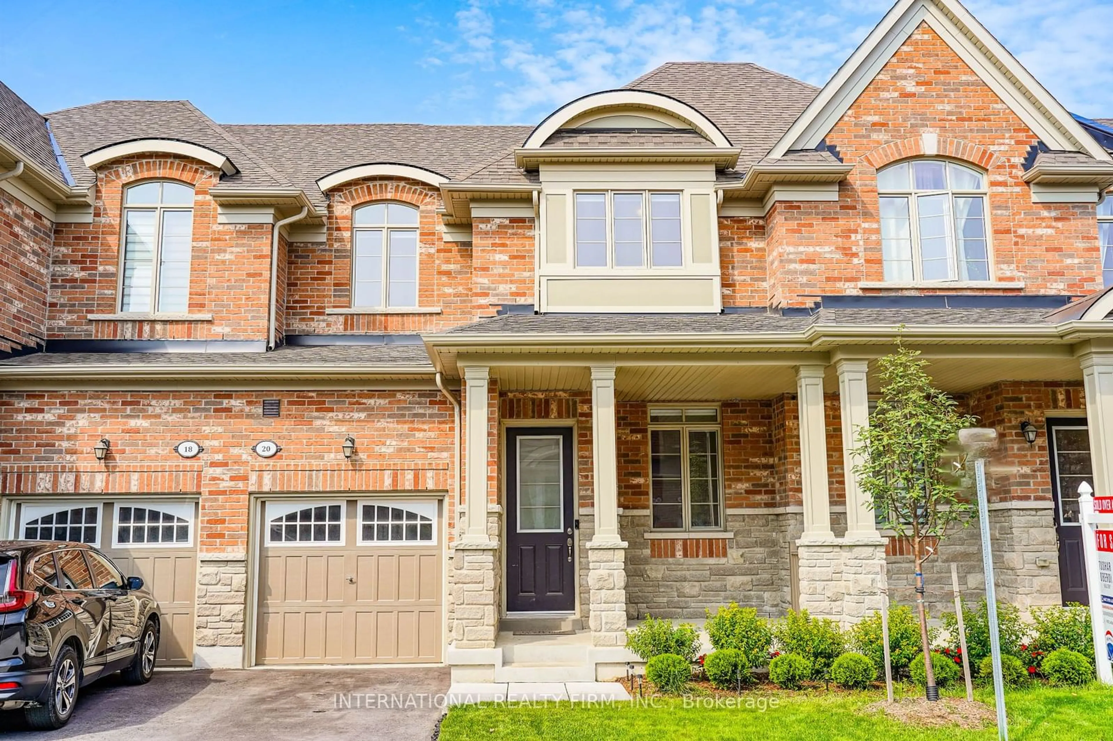 Home with brick exterior material for 20 Hickling Lane, Ajax Ontario L1T 0P9