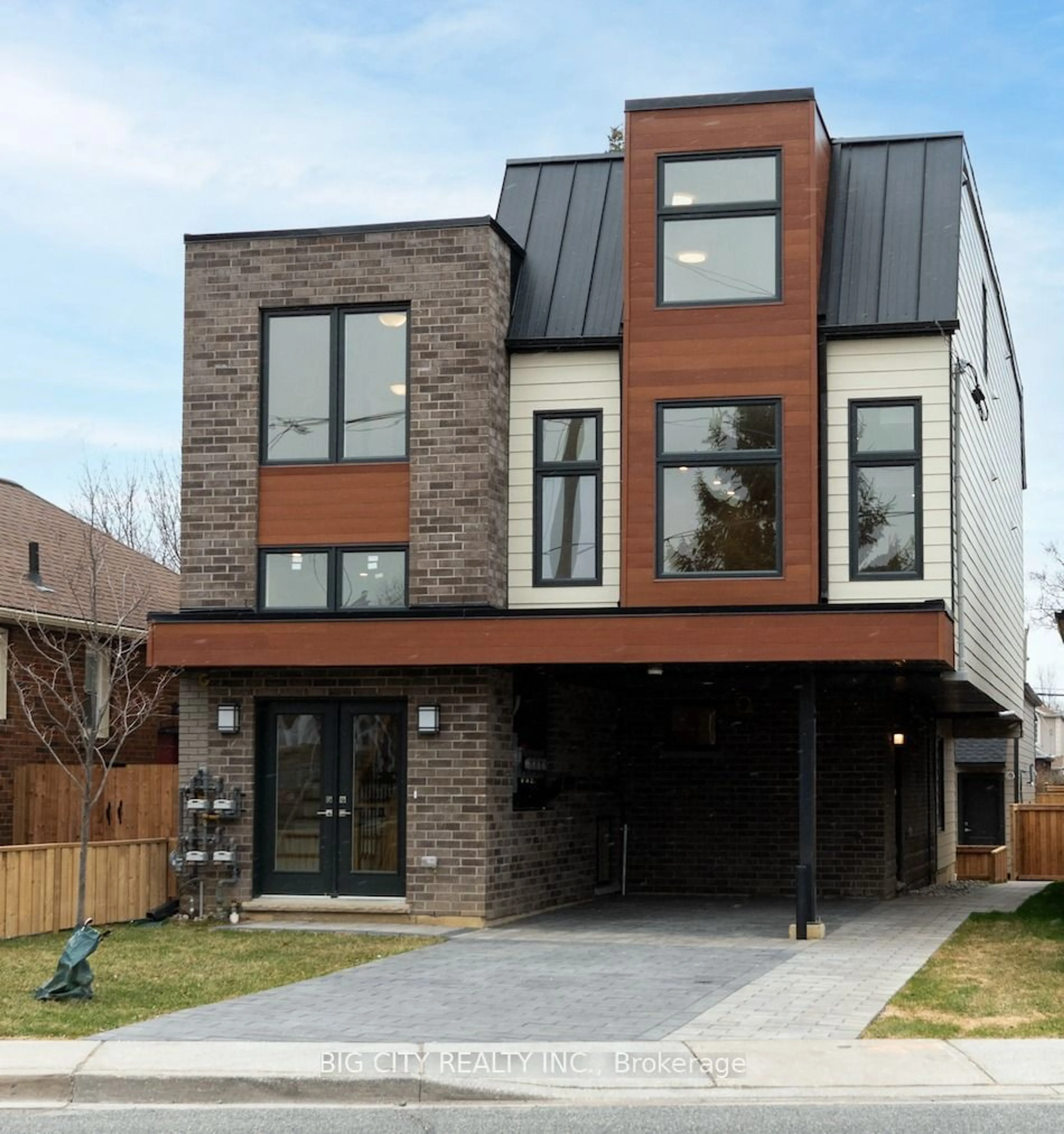 Home with brick exterior material for 319 Mortimer Ave #Suite 2, Toronto Ontario M4J 2C9