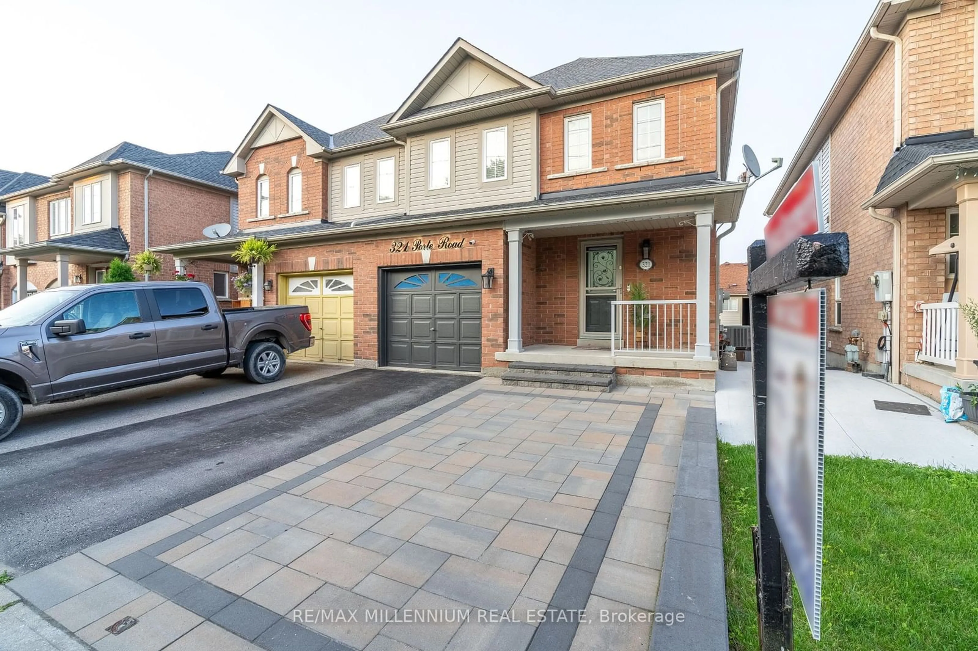 Home with brick exterior material for 321 Porte Rd, Ajax Ontario L1S 0A4