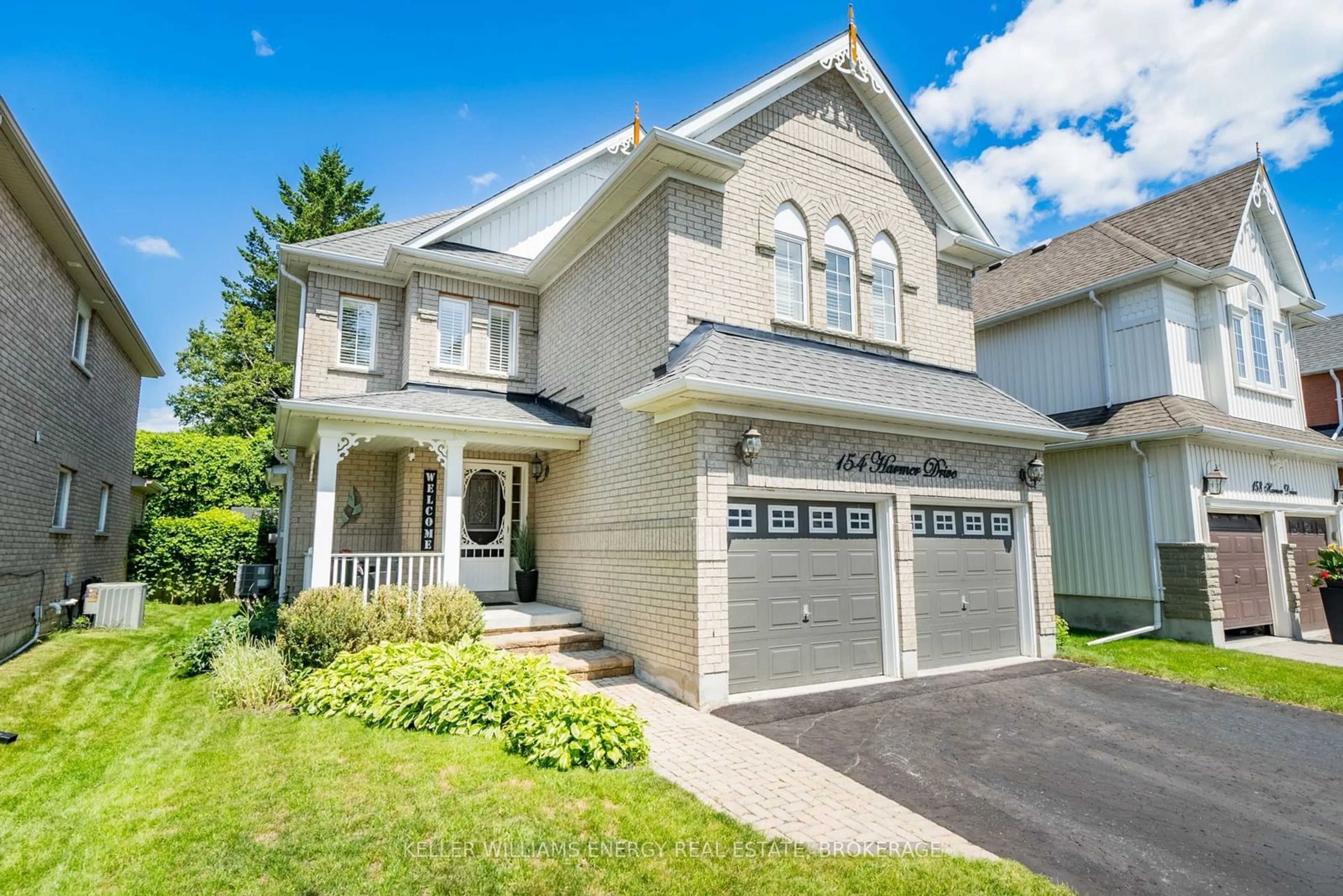 Frontside or backside of a home for 154 Harmer Dr, Clarington Ontario L1B 1P9