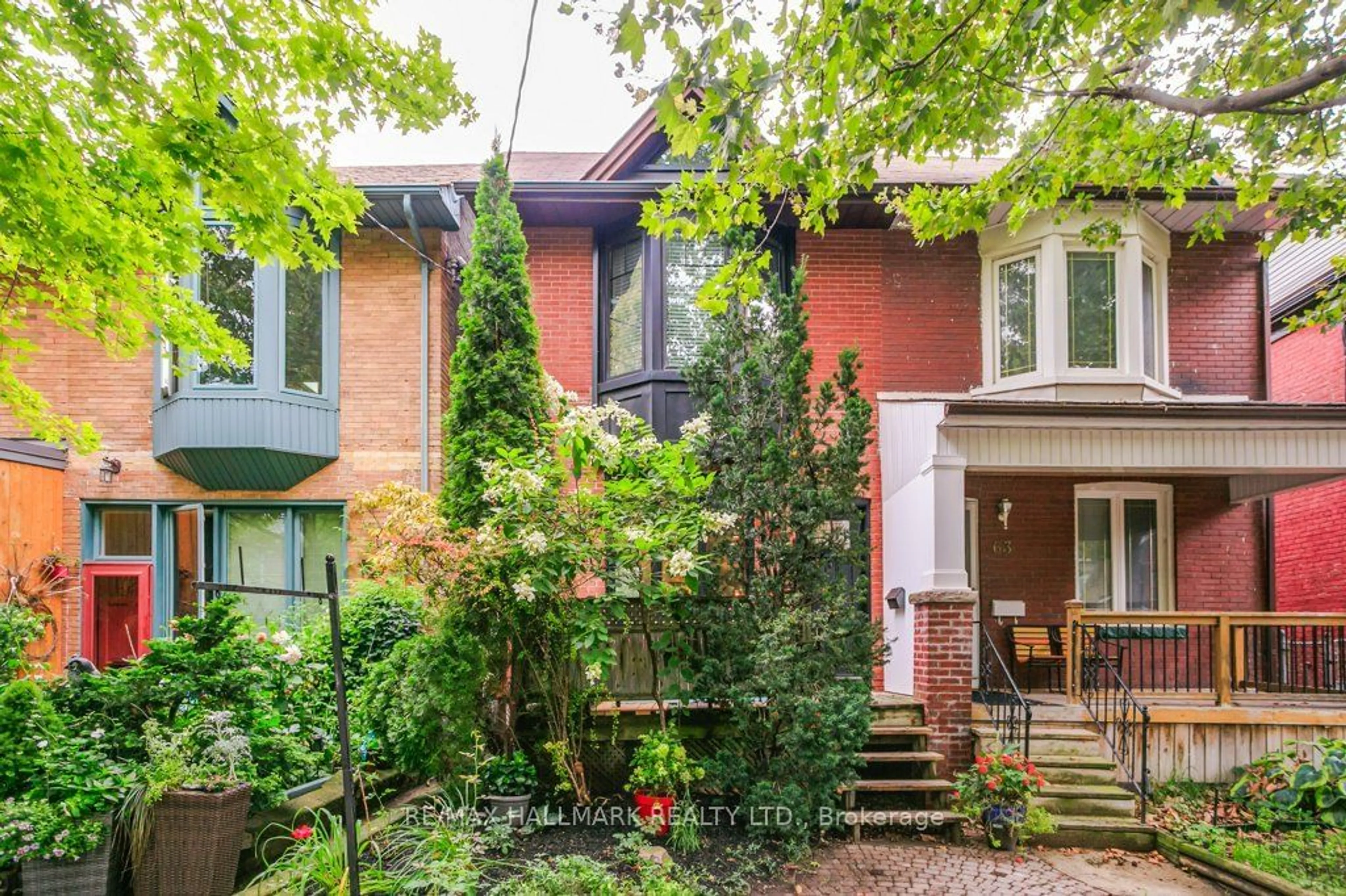 Home with brick exterior material for 65 Coady Ave, Toronto Ontario M4M 2Y9