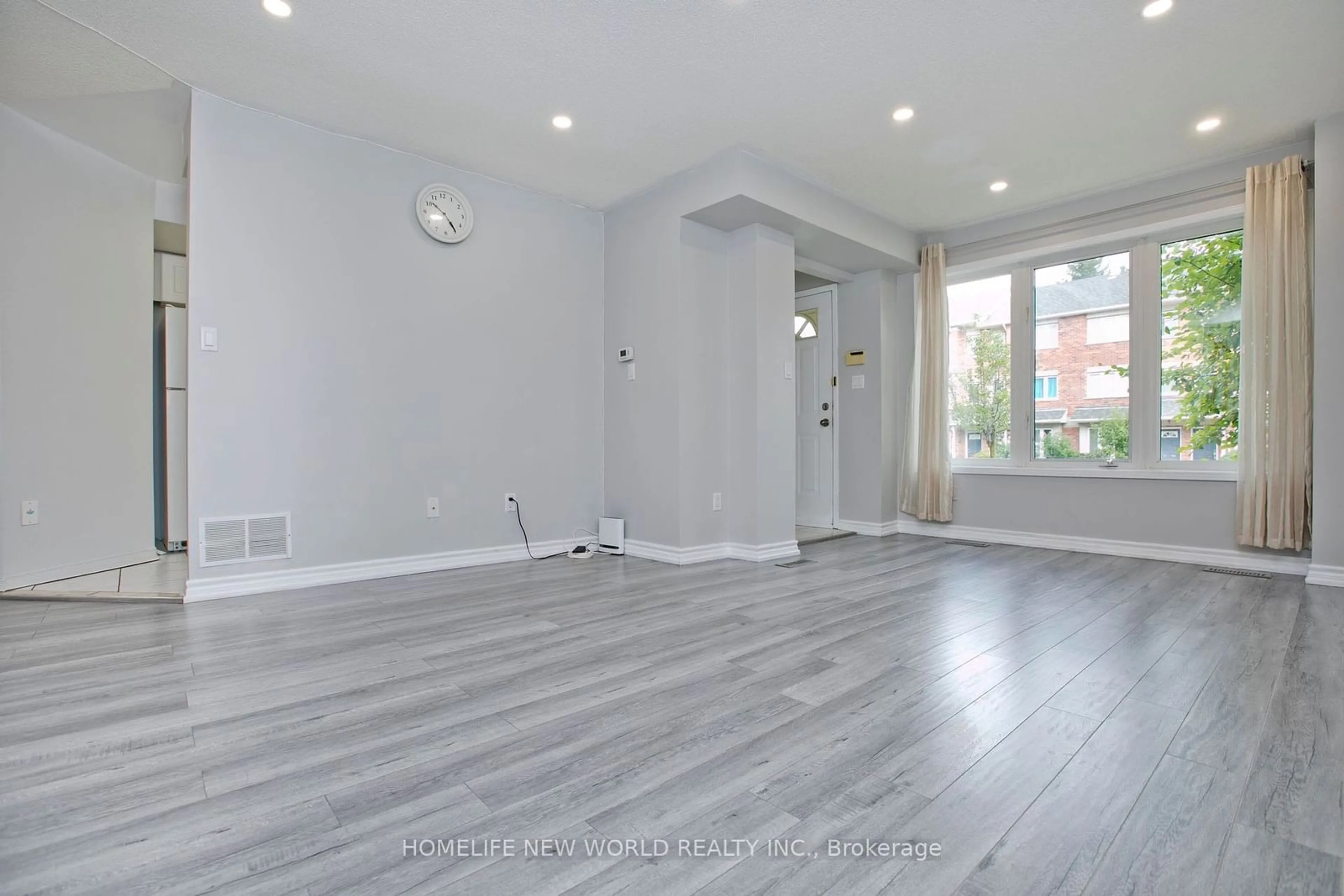 A pic of a room, wood floors for 29 Rosebank Dr #1506, Toronto Ontario M1B 5Y7