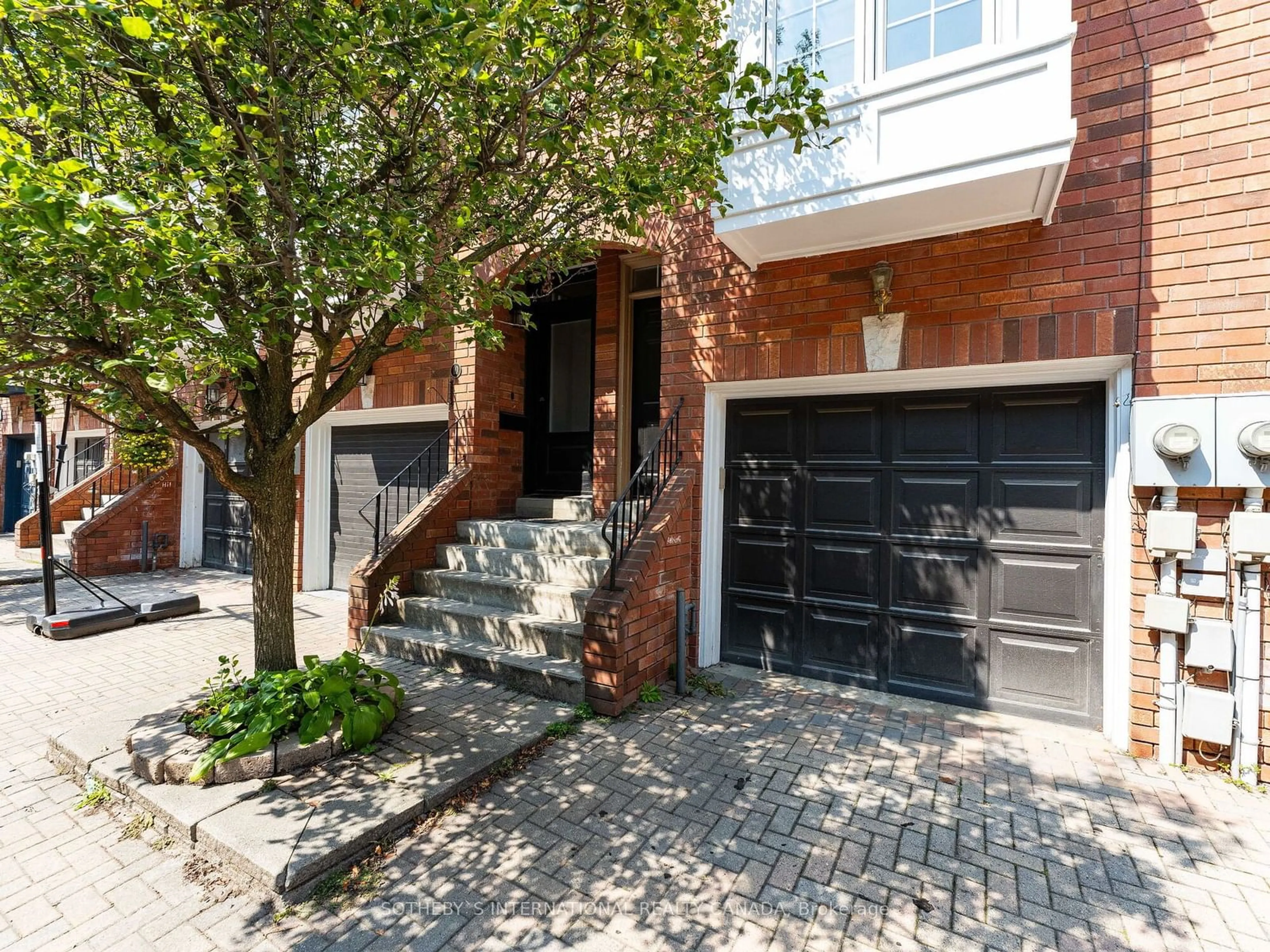 Home with brick exterior material for 12 Dorothy Bullen Pl, Toronto Ontario M4L 3X8