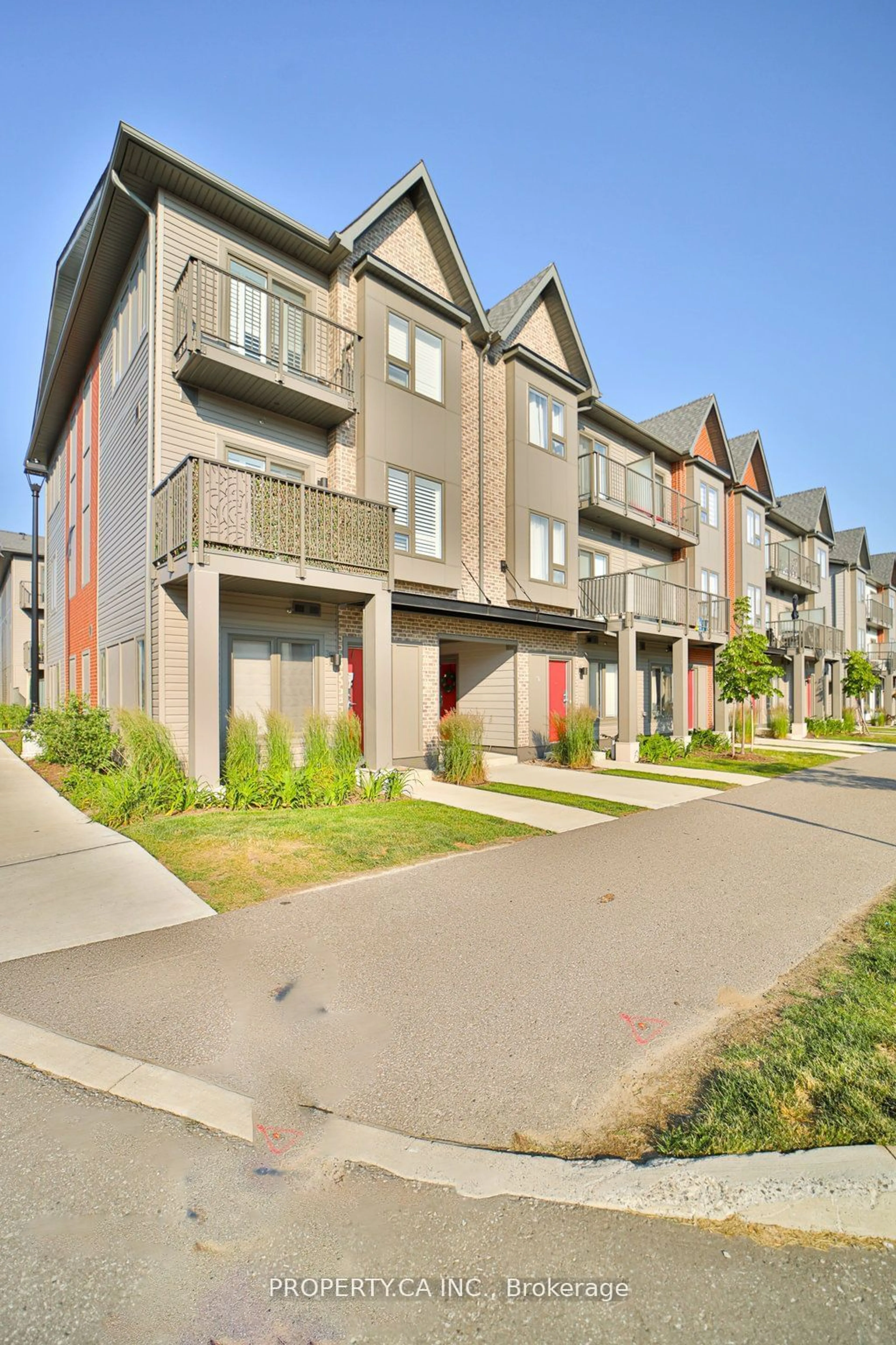 A pic from exterior of the house or condo, the fenced backyard for 2635 William Jackson Dr #102, Pickering Ontario L1X 0L2