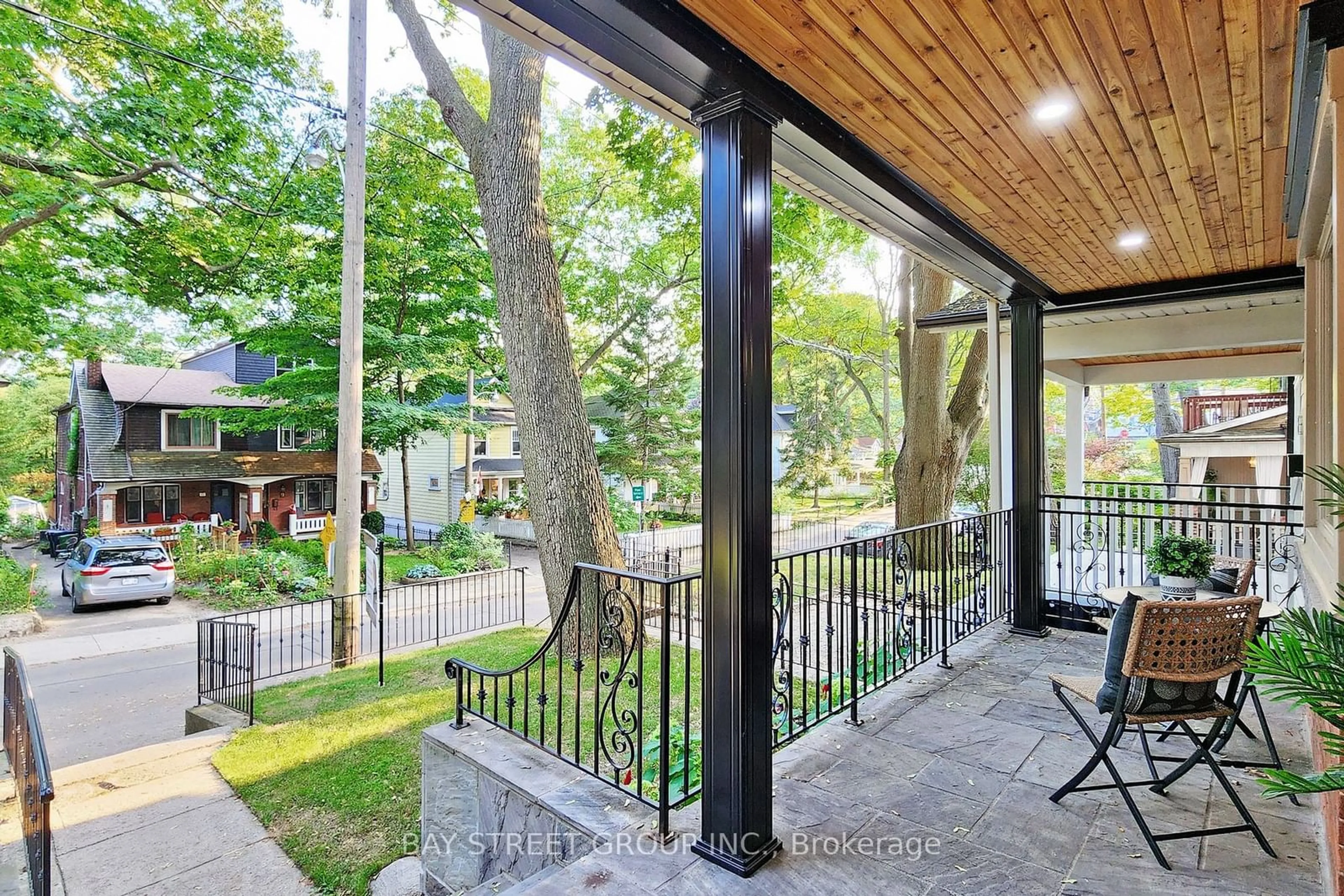 Patio, the fenced backyard for 20 Cedar Ave, Toronto Ontario M4E 1K2