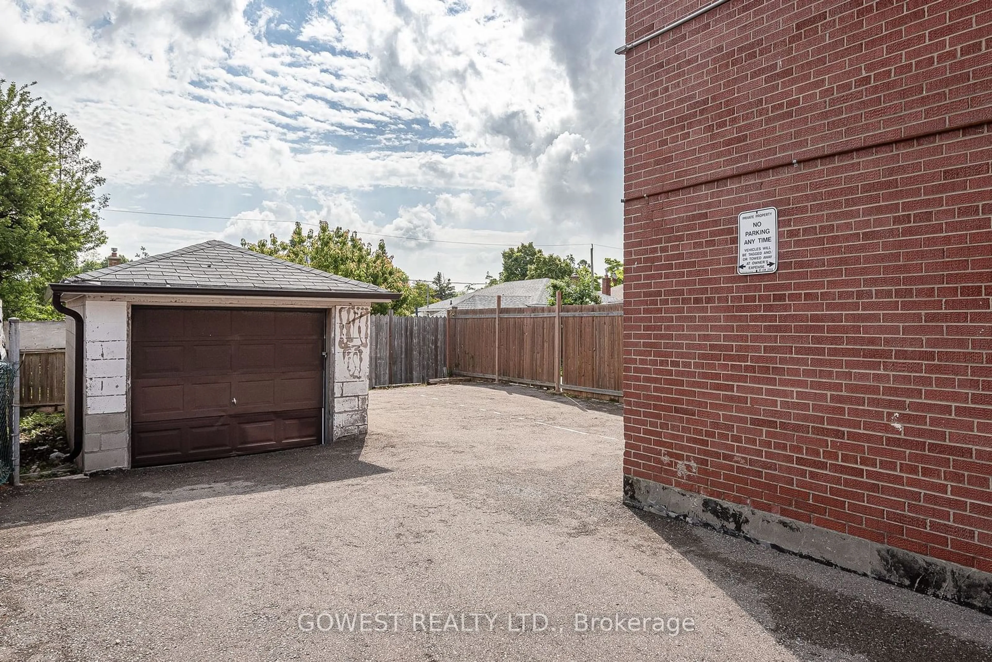 Frontside or backside of a home, the fenced backyard for 559A Birchmount Rd, Toronto Ontario M1K 1P8