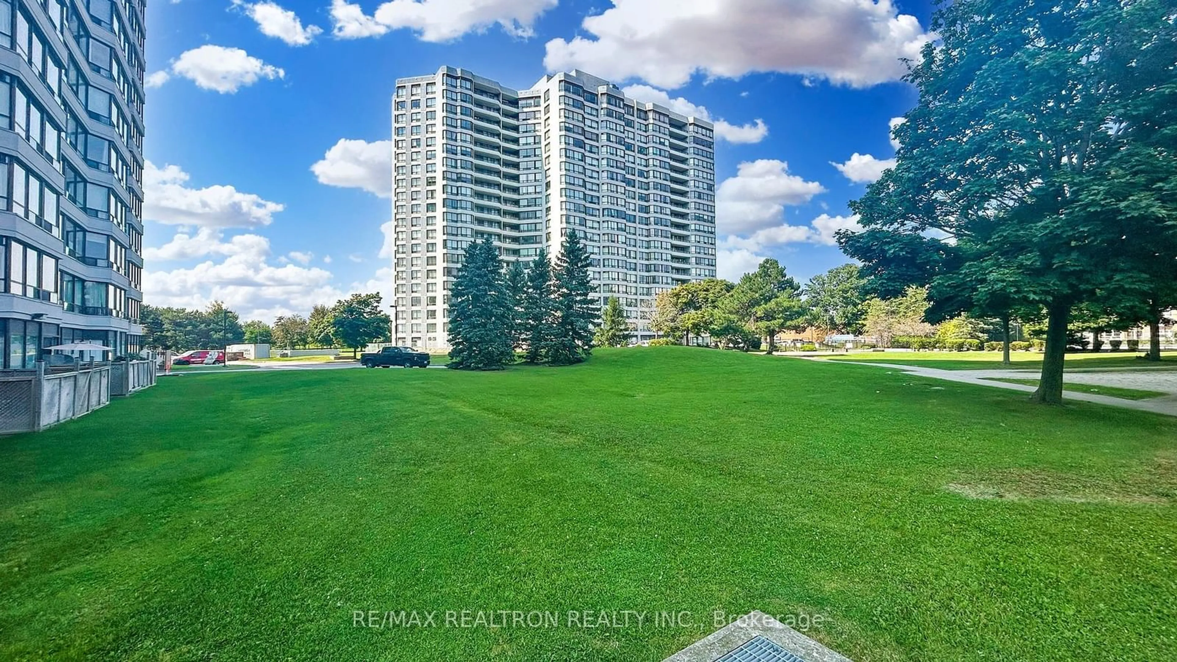 A pic from exterior of the house or condo, the fenced backyard for 300 Alton Towers Circ #PH108, Toronto Ontario M1V 4X9