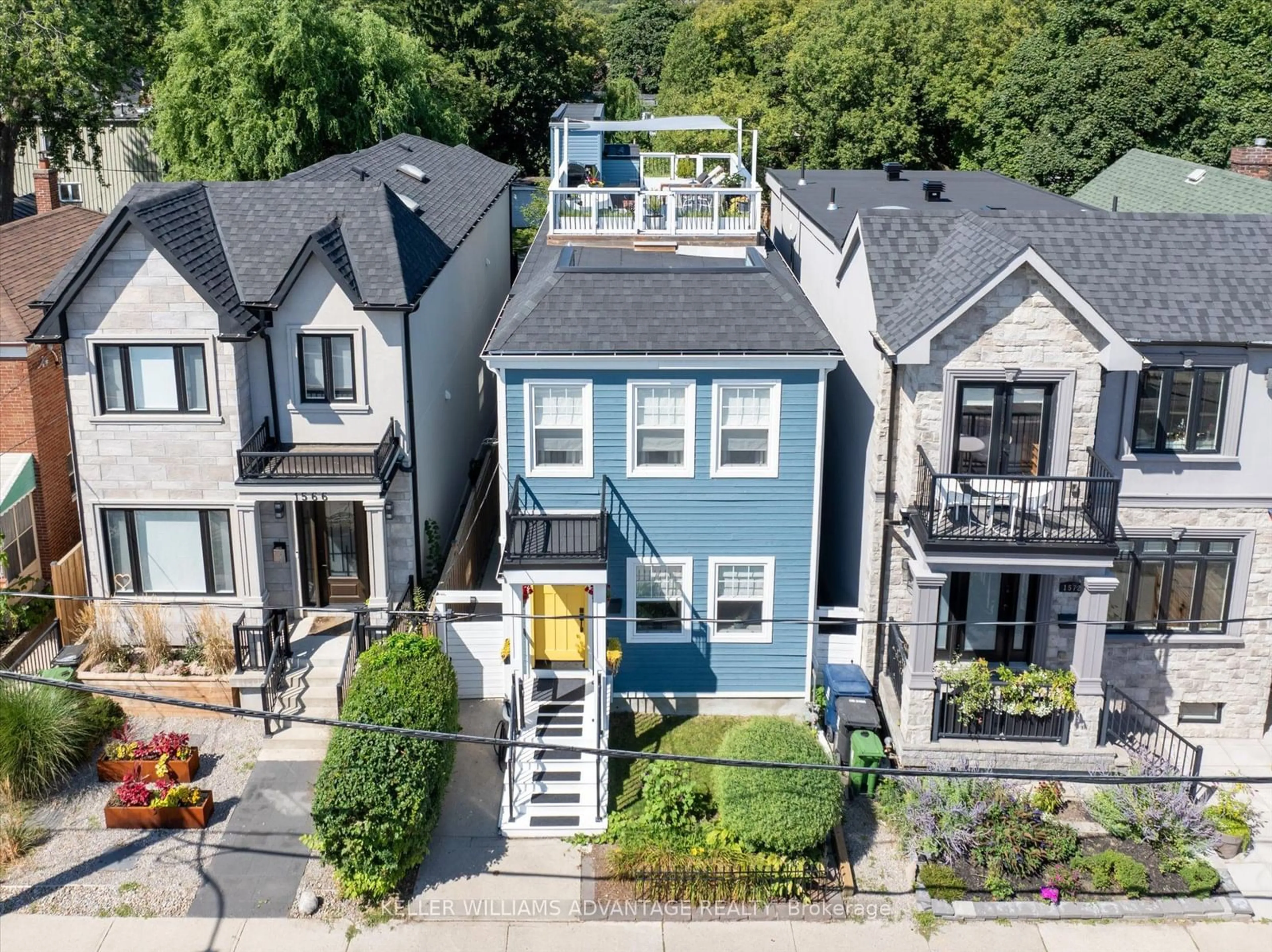 Frontside or backside of a home, the street view for 1568 Dundas St, Toronto Ontario M4L 1K8