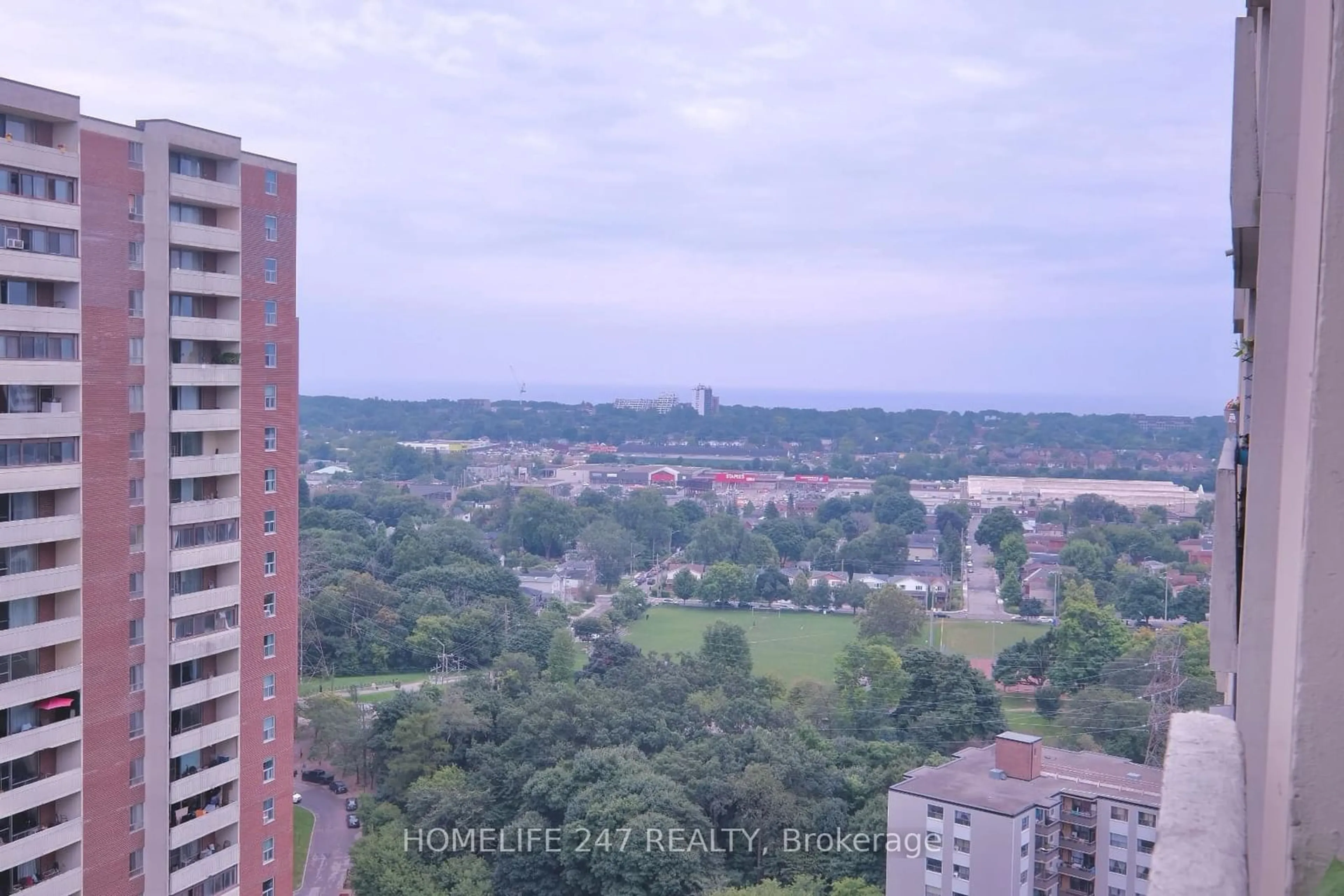 A pic from exterior of the house or condo, the view of city buildings for 1 Massey Sq #2603, Toronto Ontario M4C 5L4