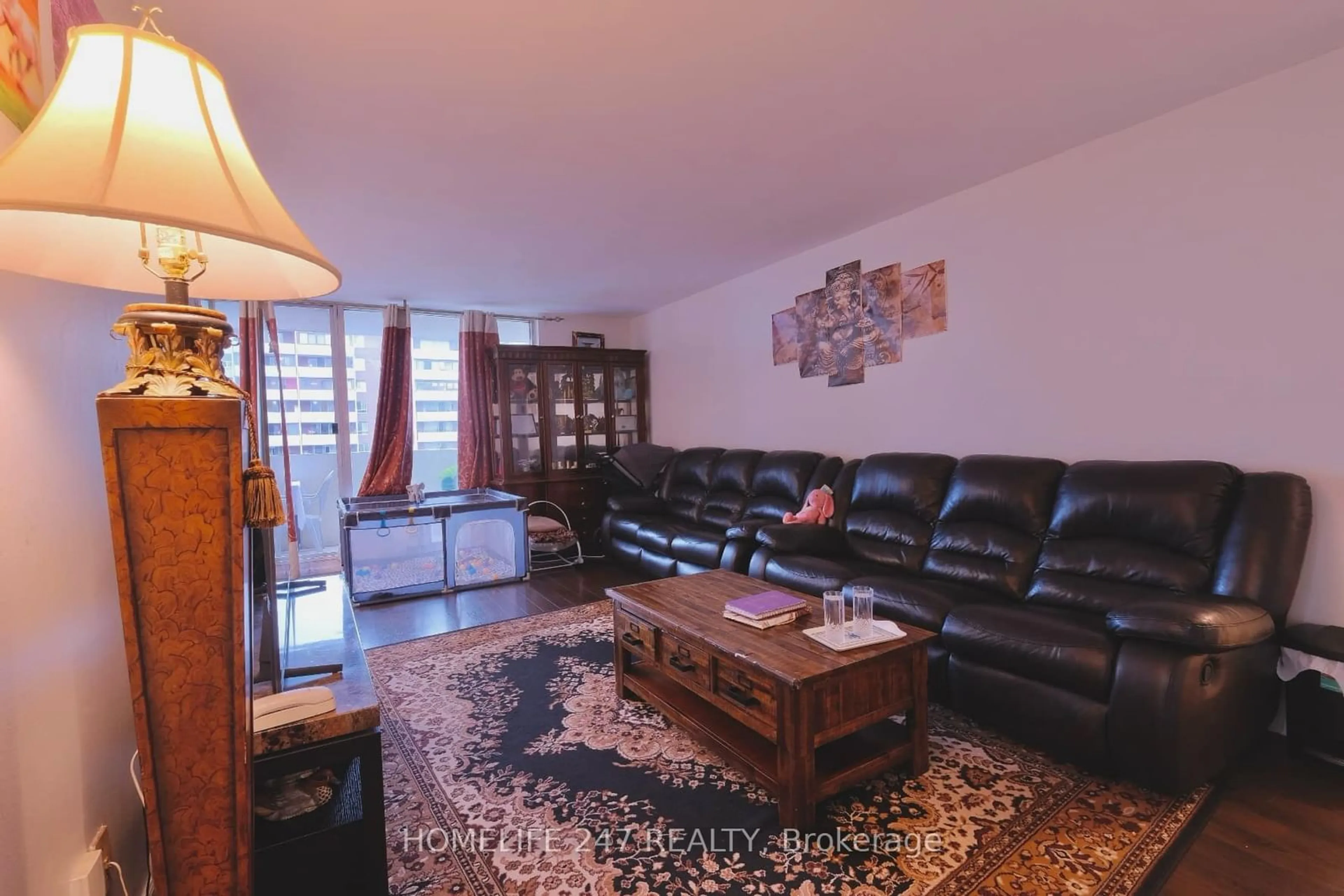 Living room, wood floors for 1 Massey Sq #2603, Toronto Ontario M4C 5L4