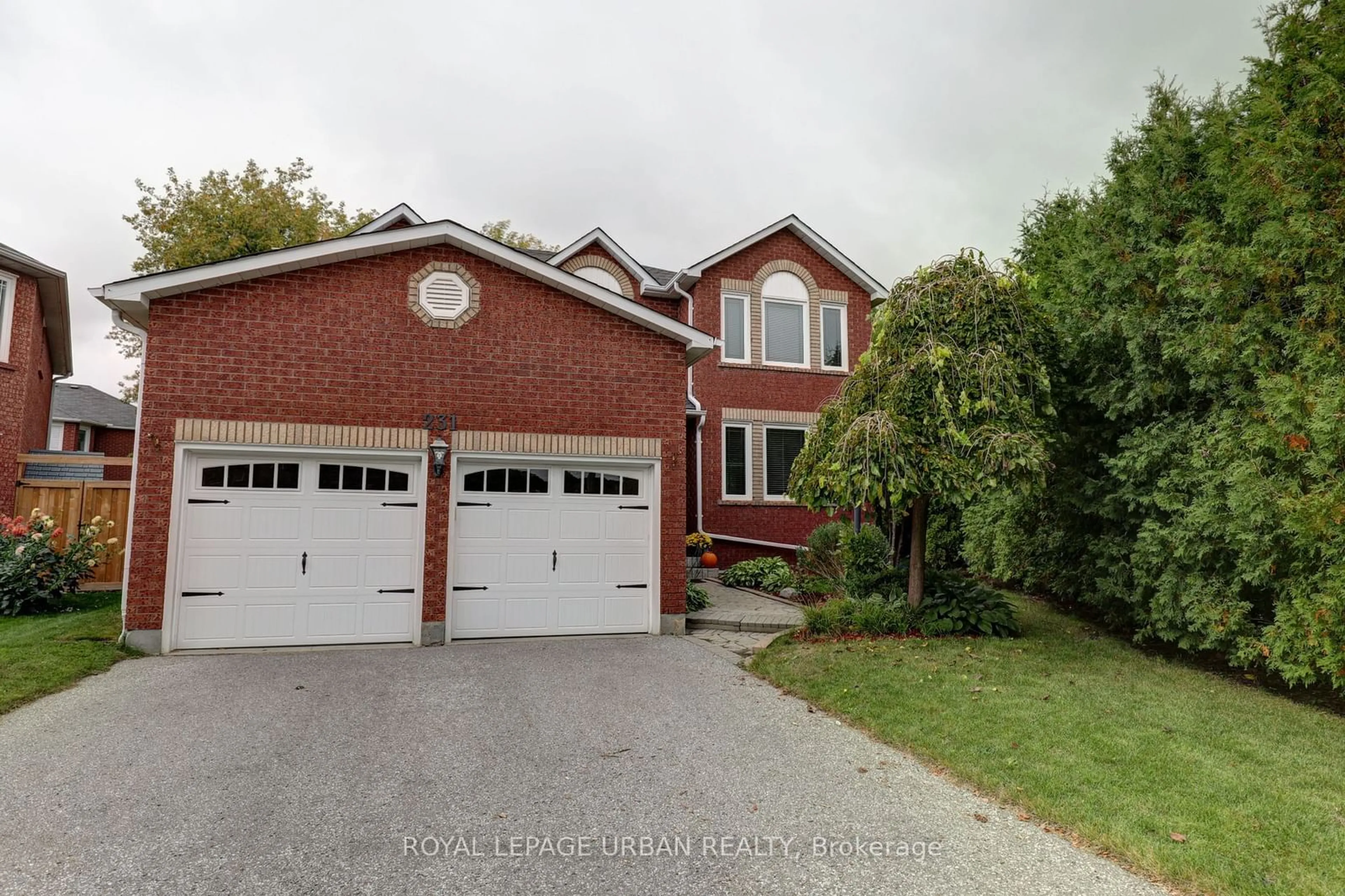 Frontside or backside of a home, the street view for 231 Mossbrook Sq, Pickering Ontario L1V 6P8