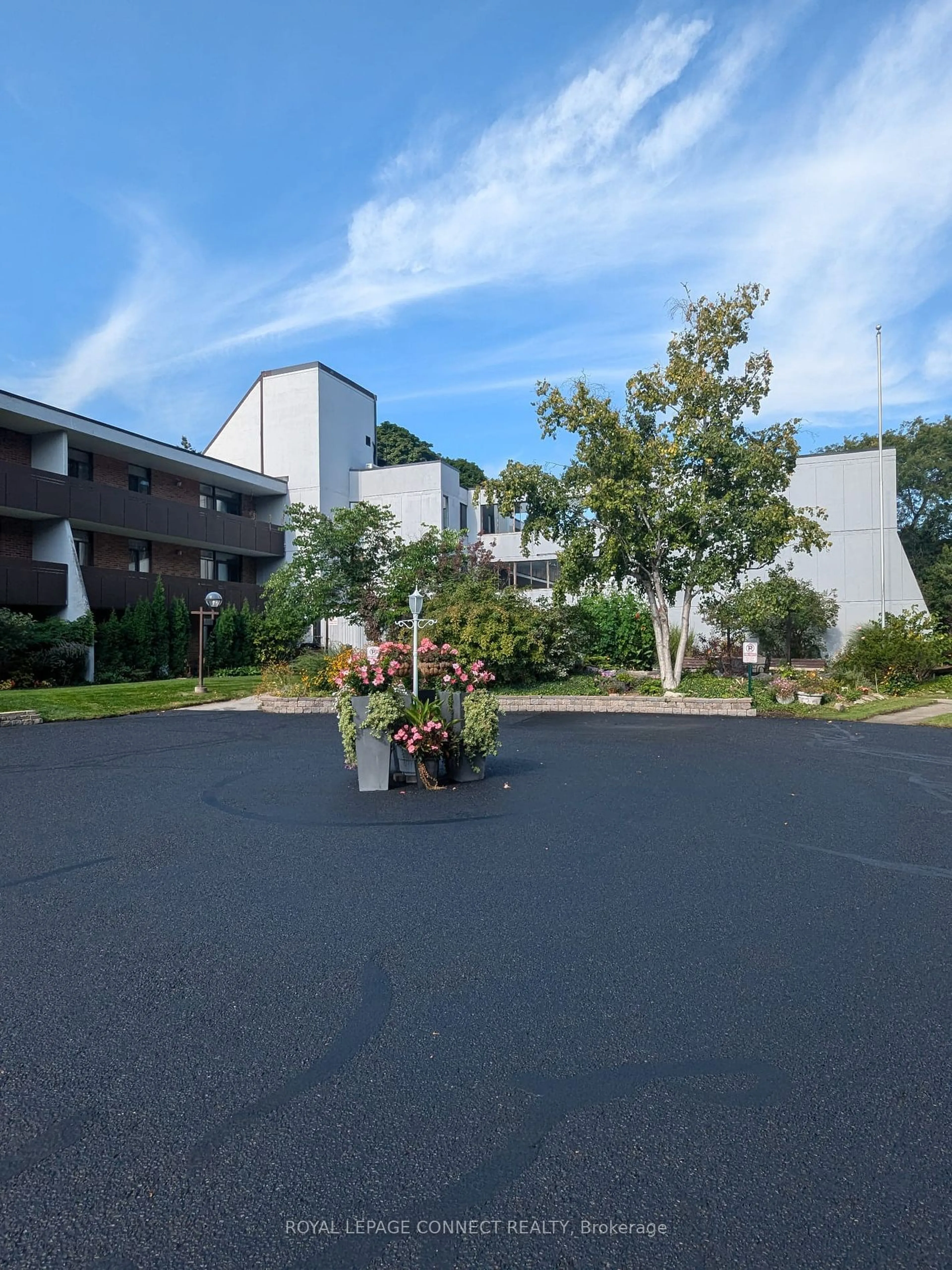 A pic from exterior of the house or condo, the front or back of building for 50 Old Kingston Rd #1-303, Toronto Ontario M1E 4Y1