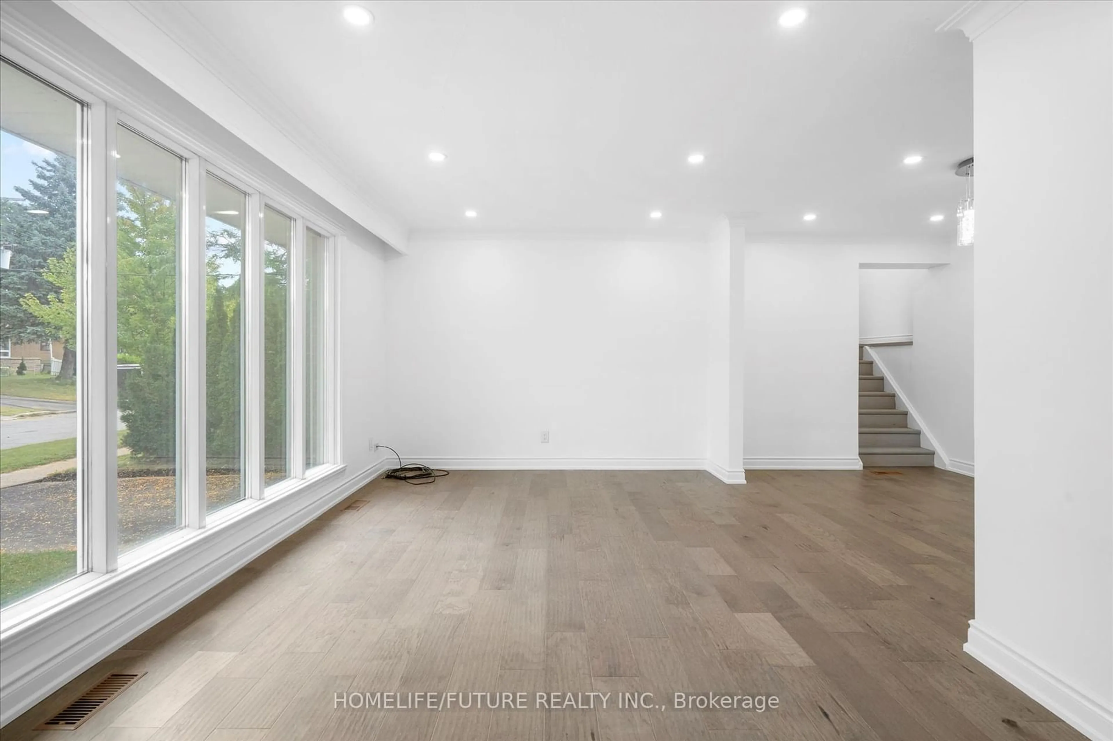 A pic of a room, wood floors for 54 Carslake Cres, Toronto Ontario M1J 2A7