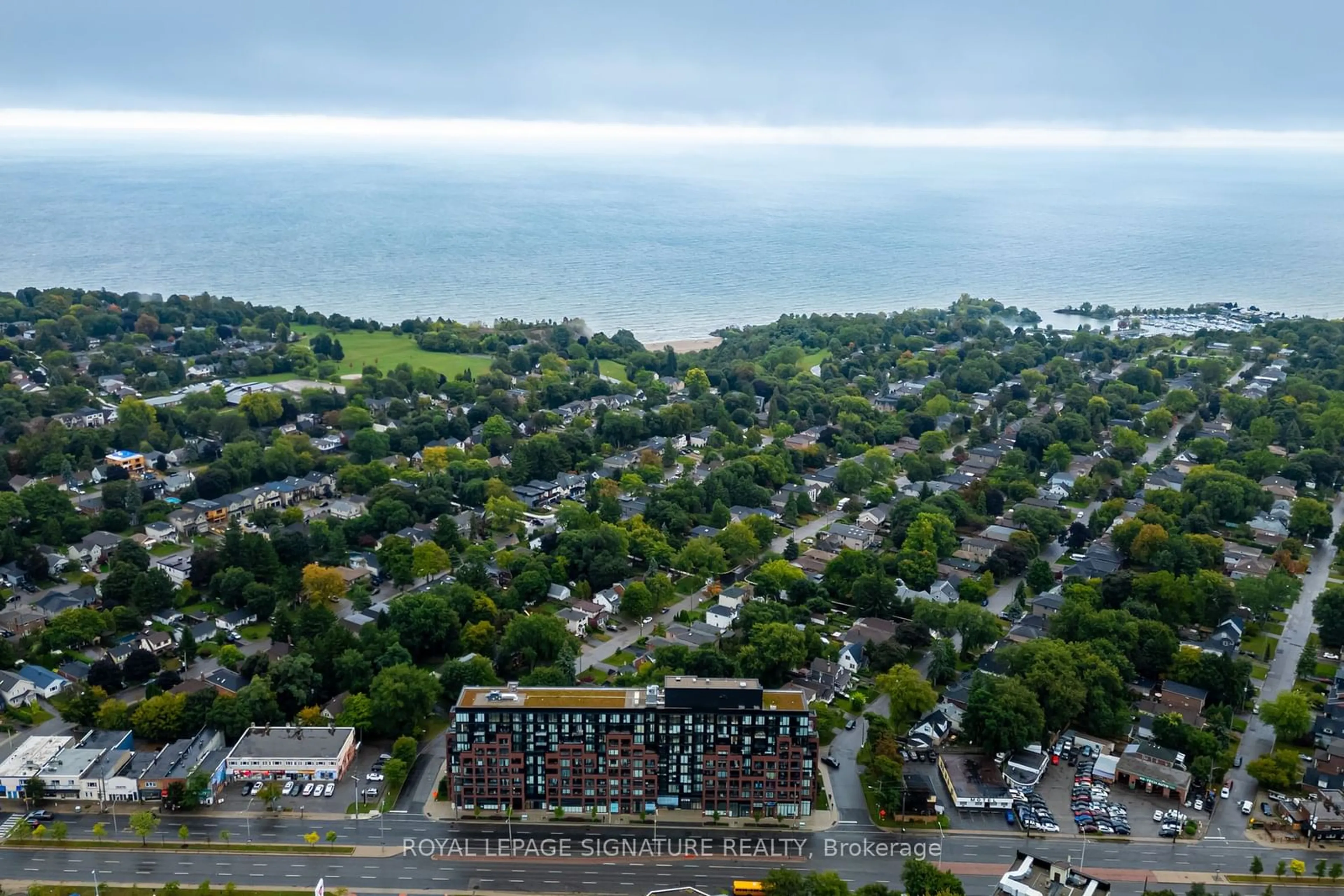 A pic from outside/outdoor area/front of a property/back of a property/a pic from drone, unknown for 2799 Kingston Rd #313, Toronto Ontario M1M 0E3