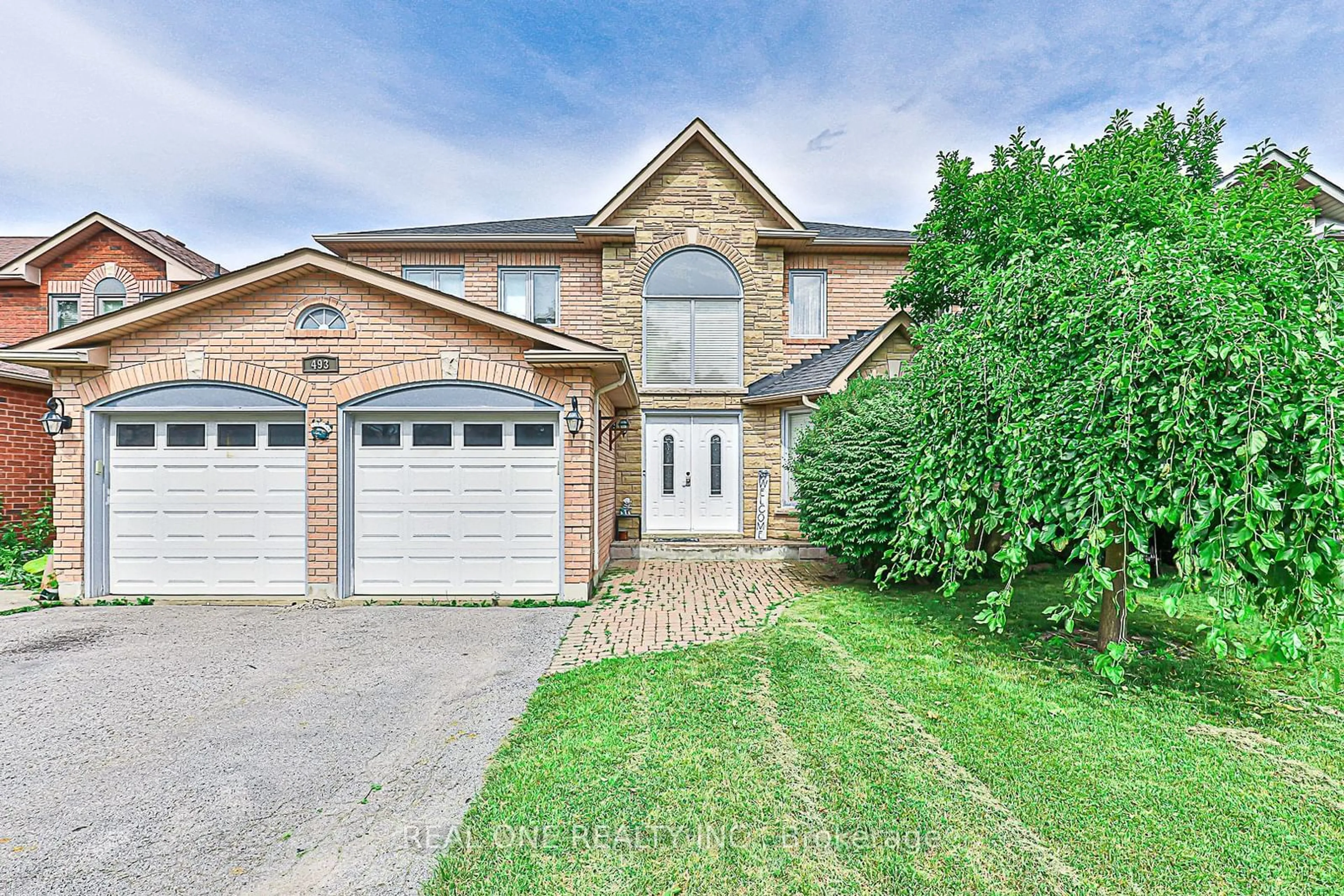 Frontside or backside of a home, the street view for 493 Sandalwood Crt, Oshawa Ontario L1G 7X9