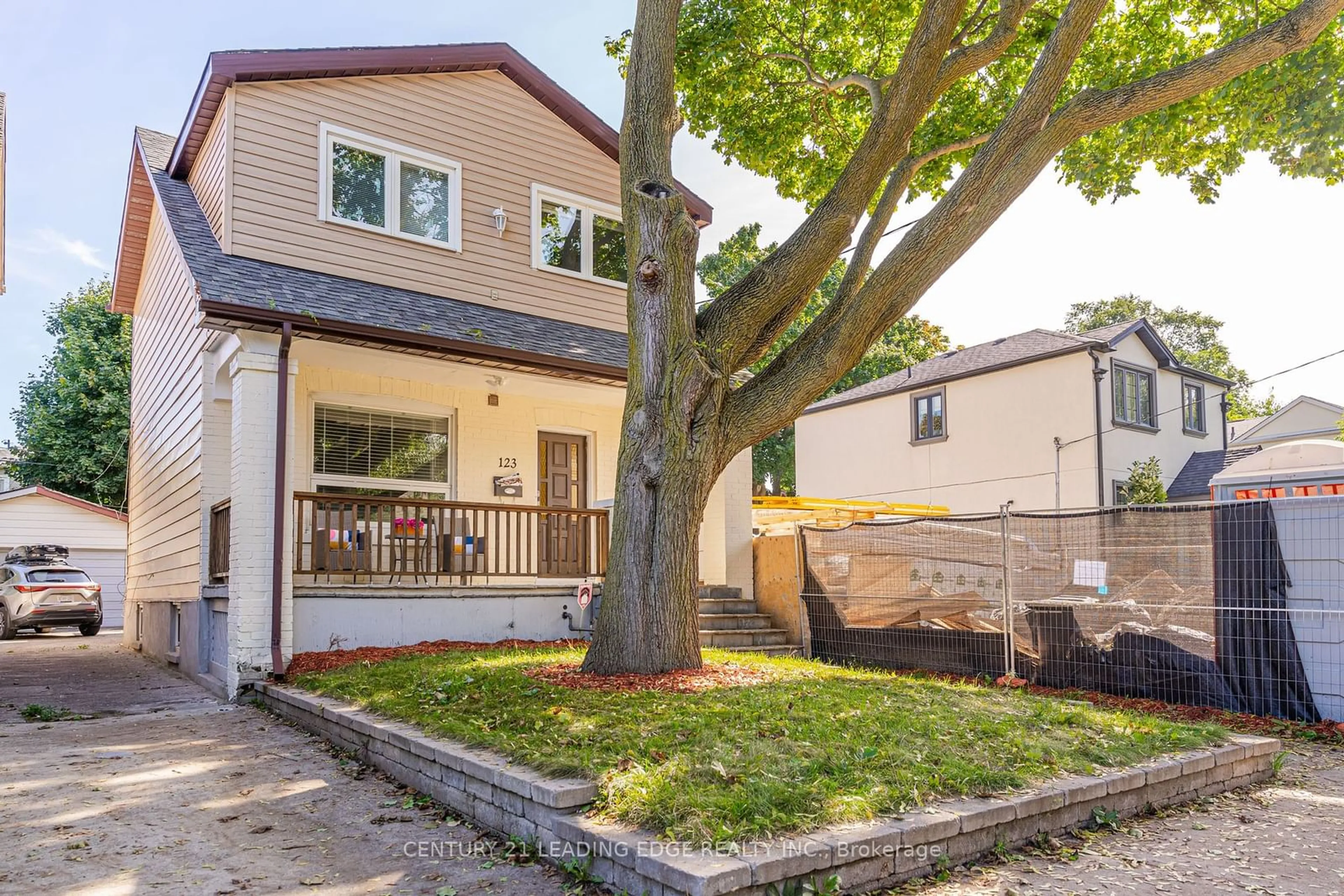 Frontside or backside of a home, the fenced backyard for 123 Cadorna Ave, Toronto Ontario M4J 3X3