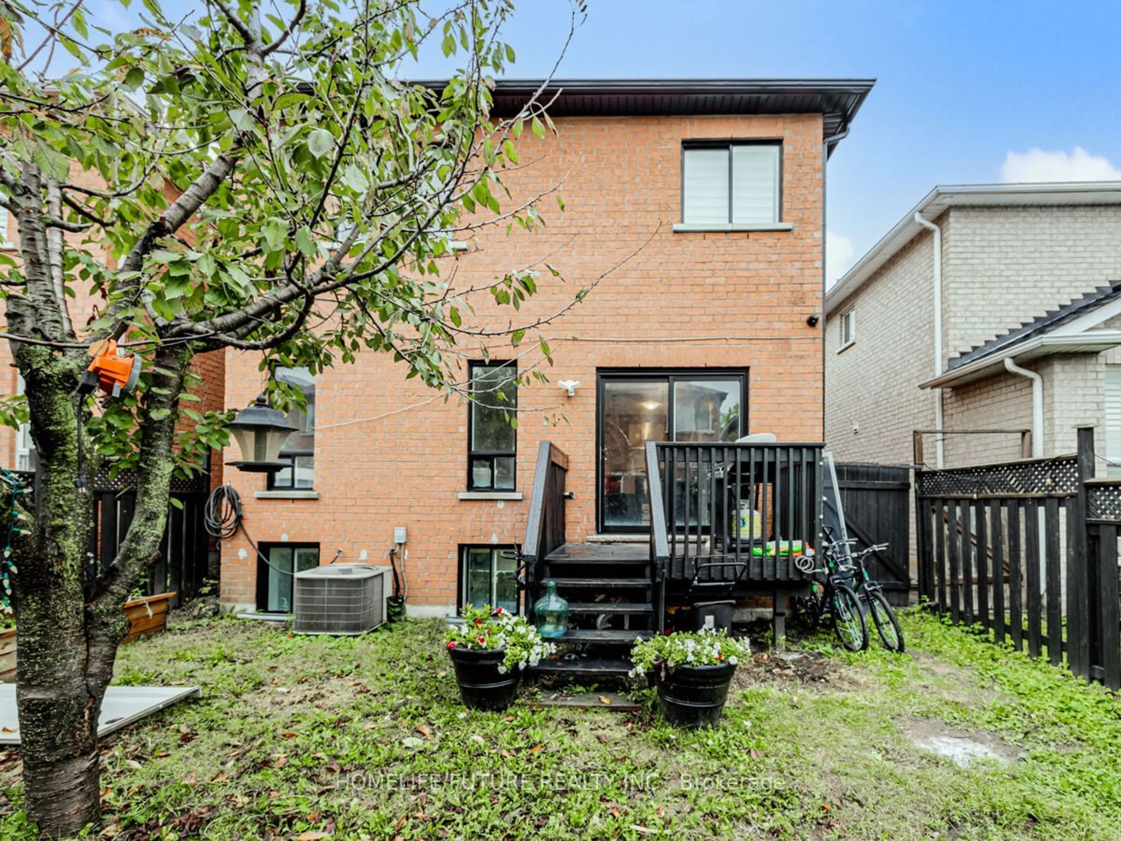 Frontside or backside of a home, the fenced backyard for 95 Pinery Tr, Toronto Ontario M1B 6C2