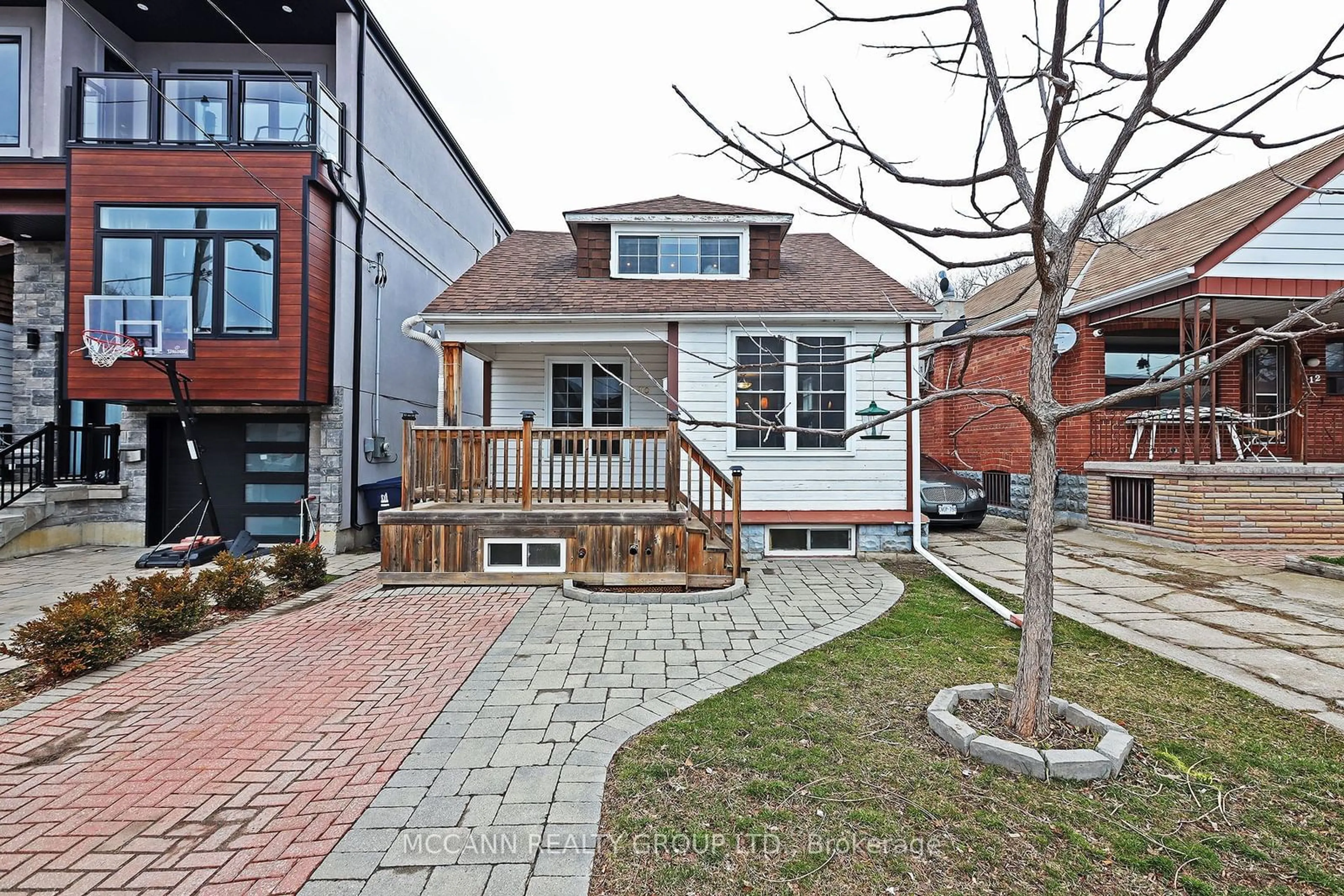 A pic from exterior of the house or condo, the fenced backyard for 210 Gowan Ave, Toronto Ontario M4J 2K6