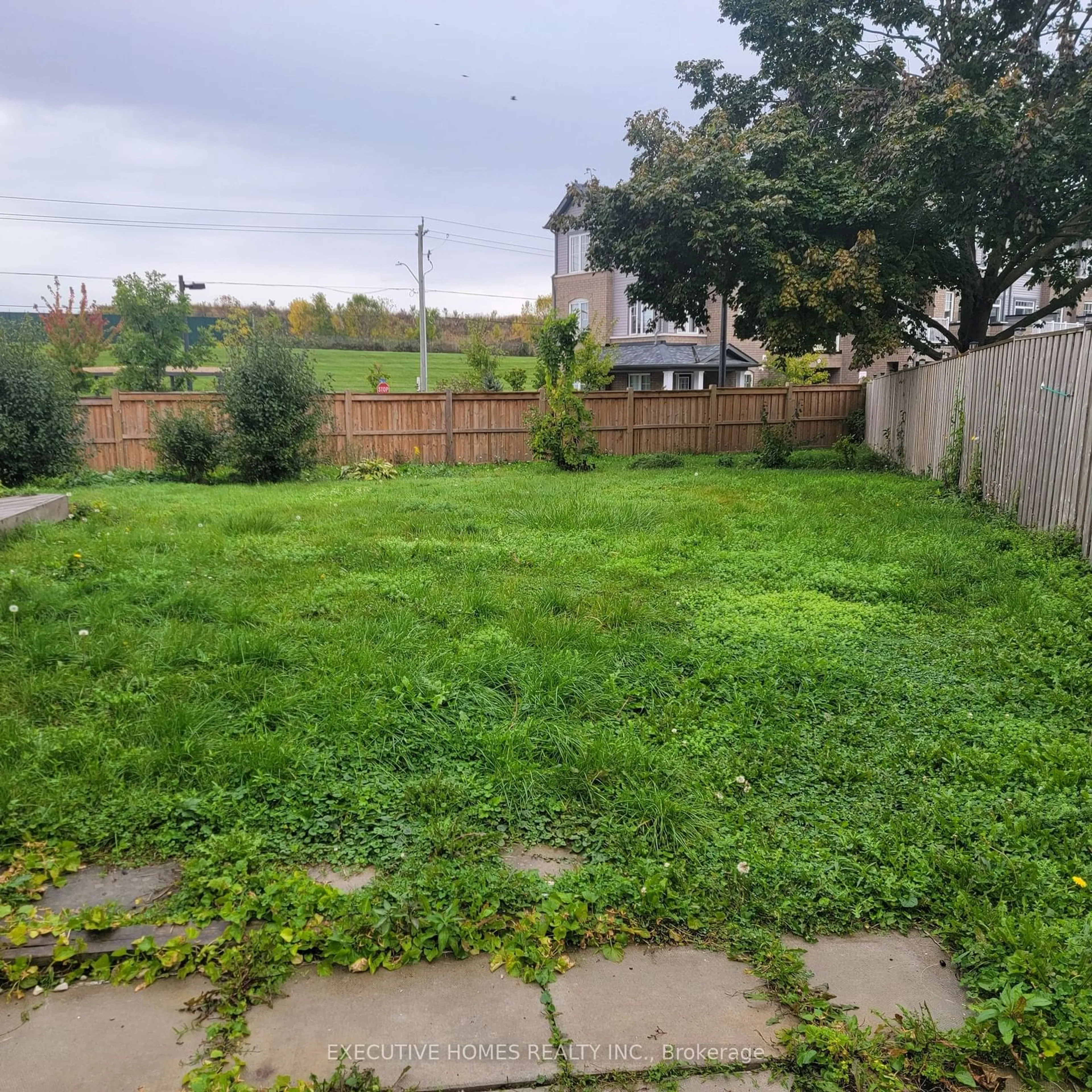 Frontside or backside of a home, the fenced backyard for 1411 Beaverbrook Crt, Oshawa Ontario L1J 8L1