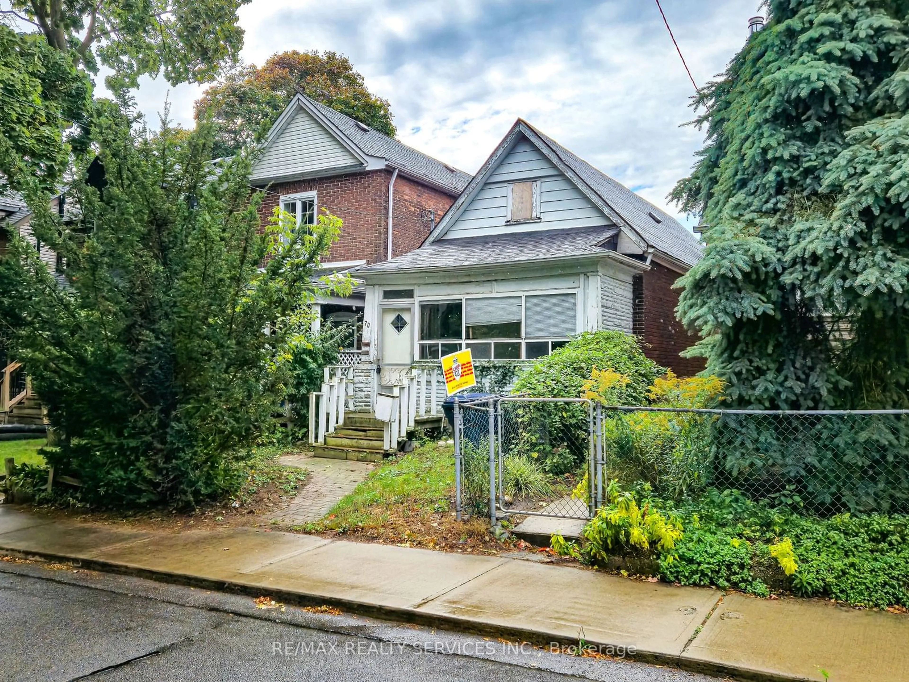 Frontside or backside of a home, the street view for 70 Drayton Ave, Toronto Ontario M4C 3L9