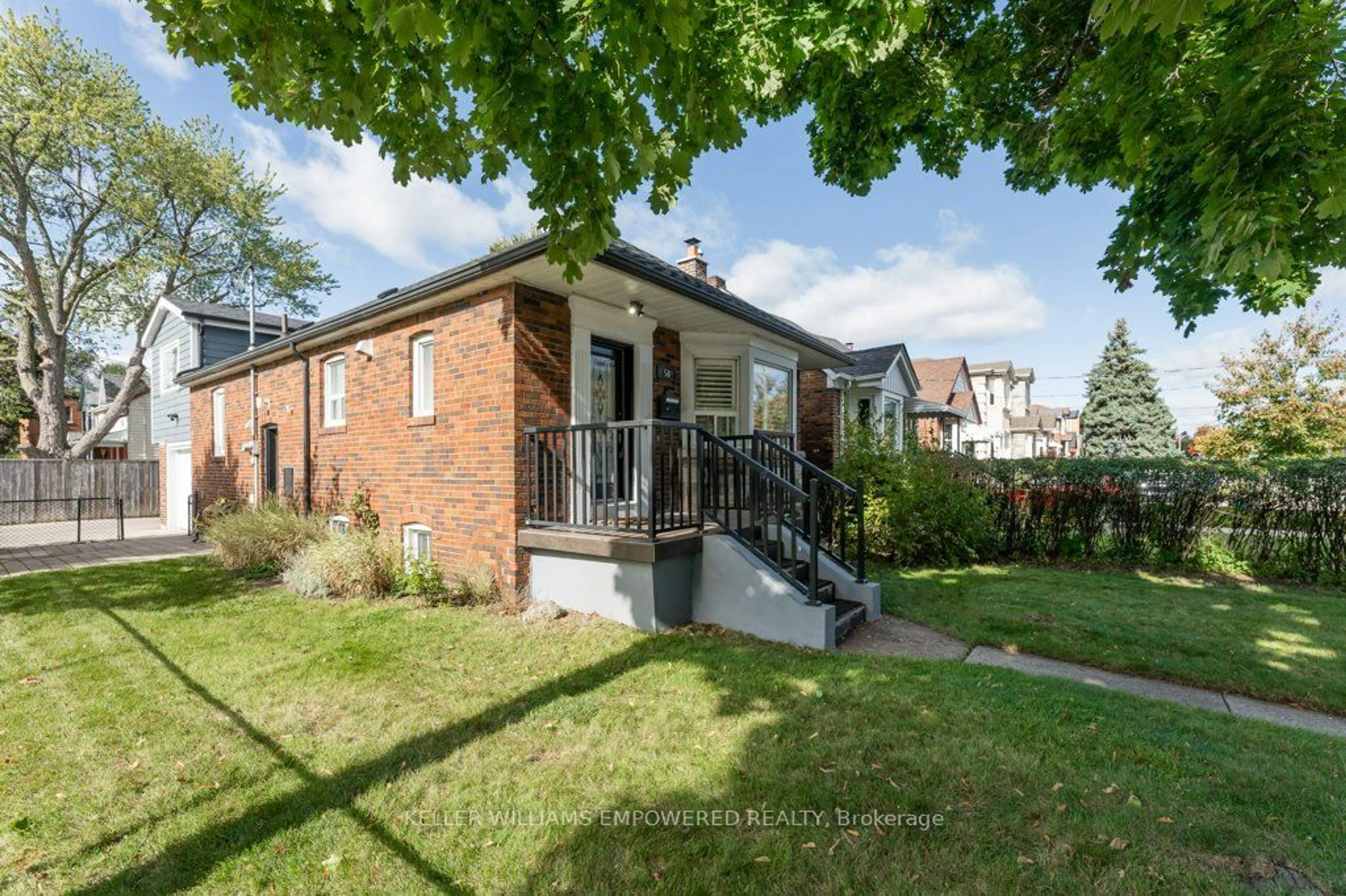 A pic from exterior of the house or condo, the fenced backyard for 50 Roosevelt Rd, Toronto Ontario M4J 4T7