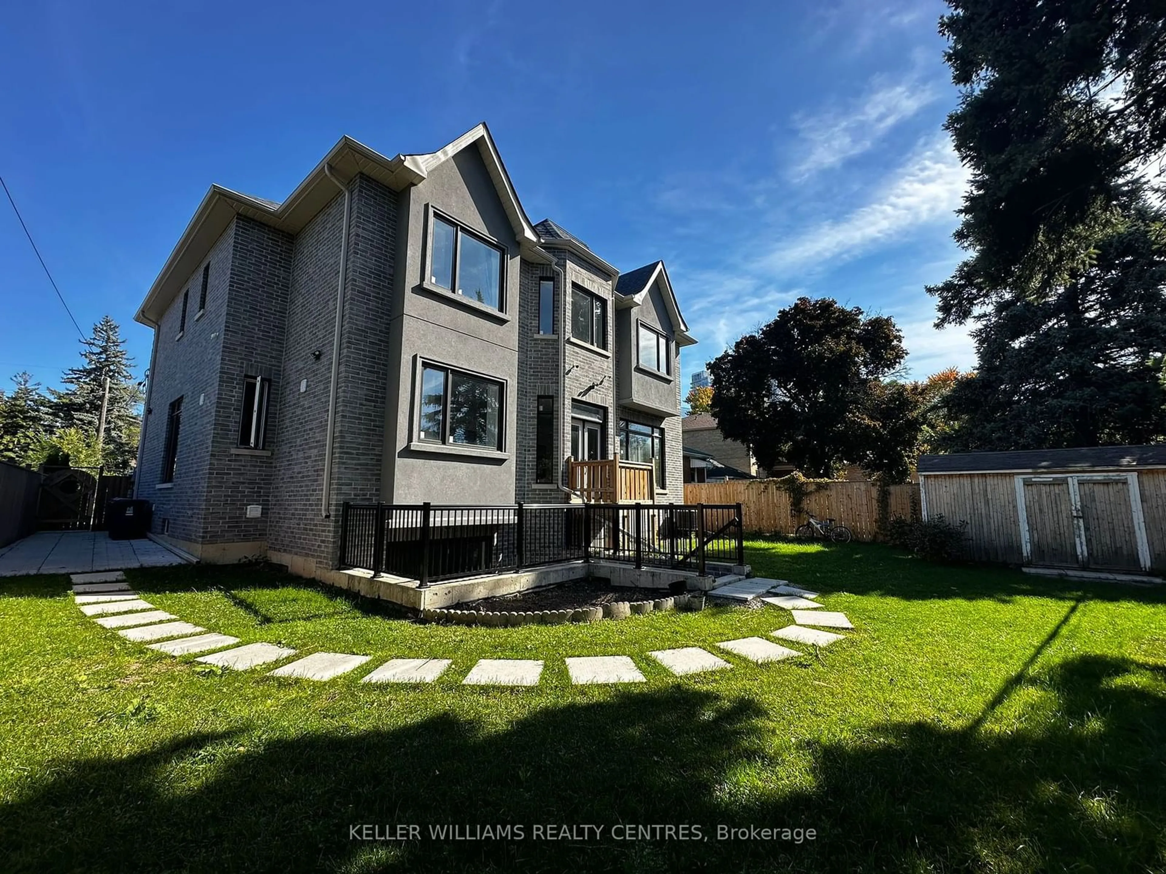 Frontside or backside of a home, the fenced backyard for 121 Earlton Rd, Toronto Ontario M1T 2R8