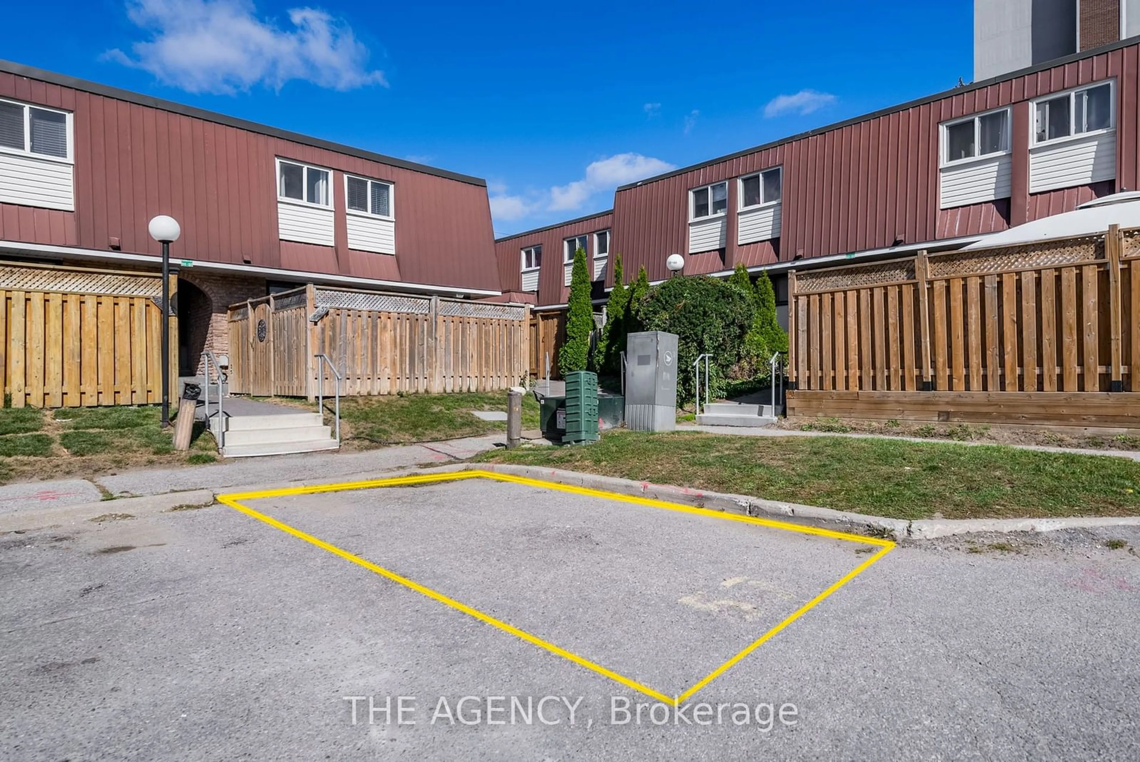 A pic from exterior of the house or condo, the fenced backyard for 1333 Mary St #57, Oshawa Ontario L1G 6Z3