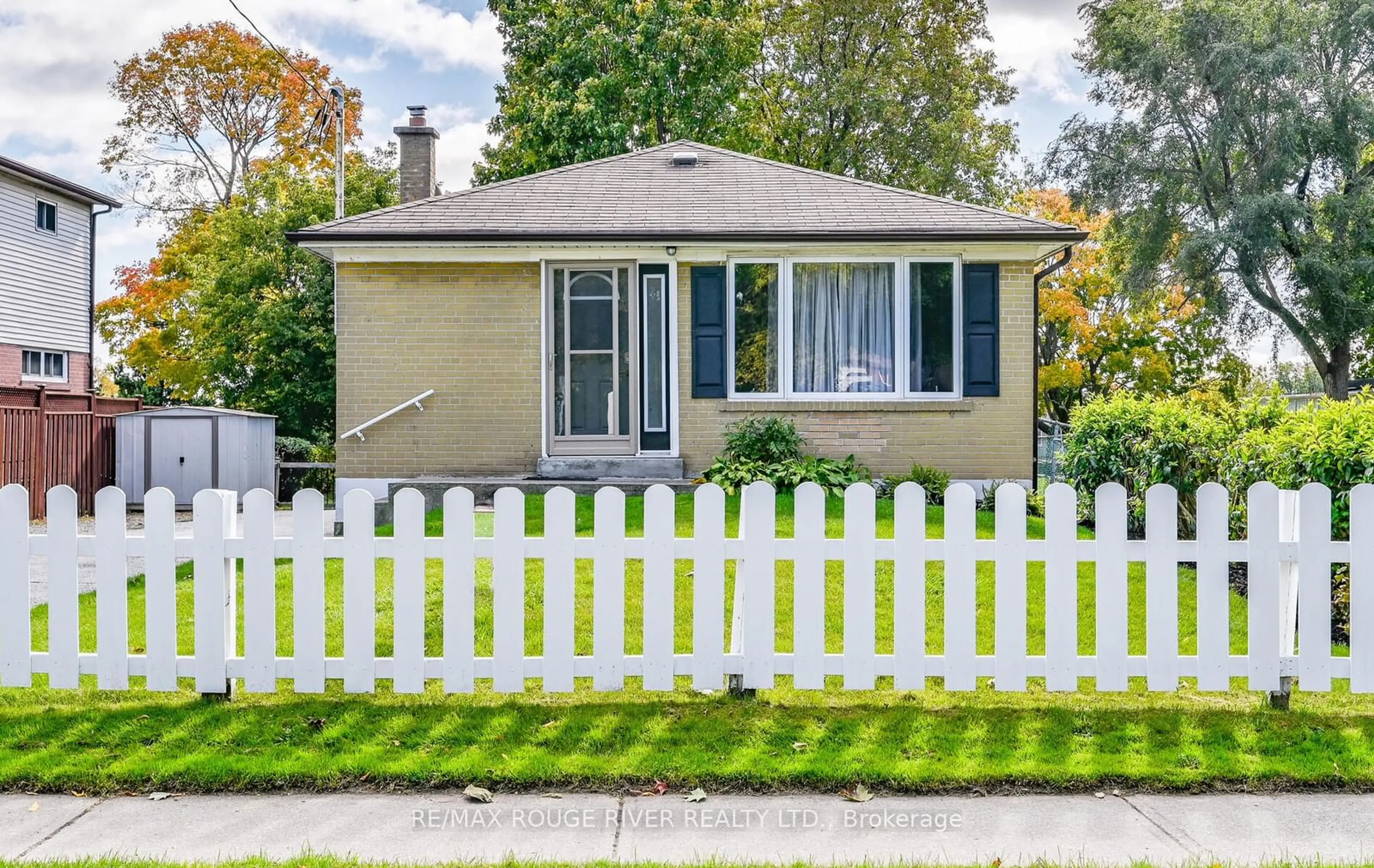 Frontside or backside of a home, the fenced backyard for 451 Phillip Murray Ave, Oshawa Ontario L1J 1H6