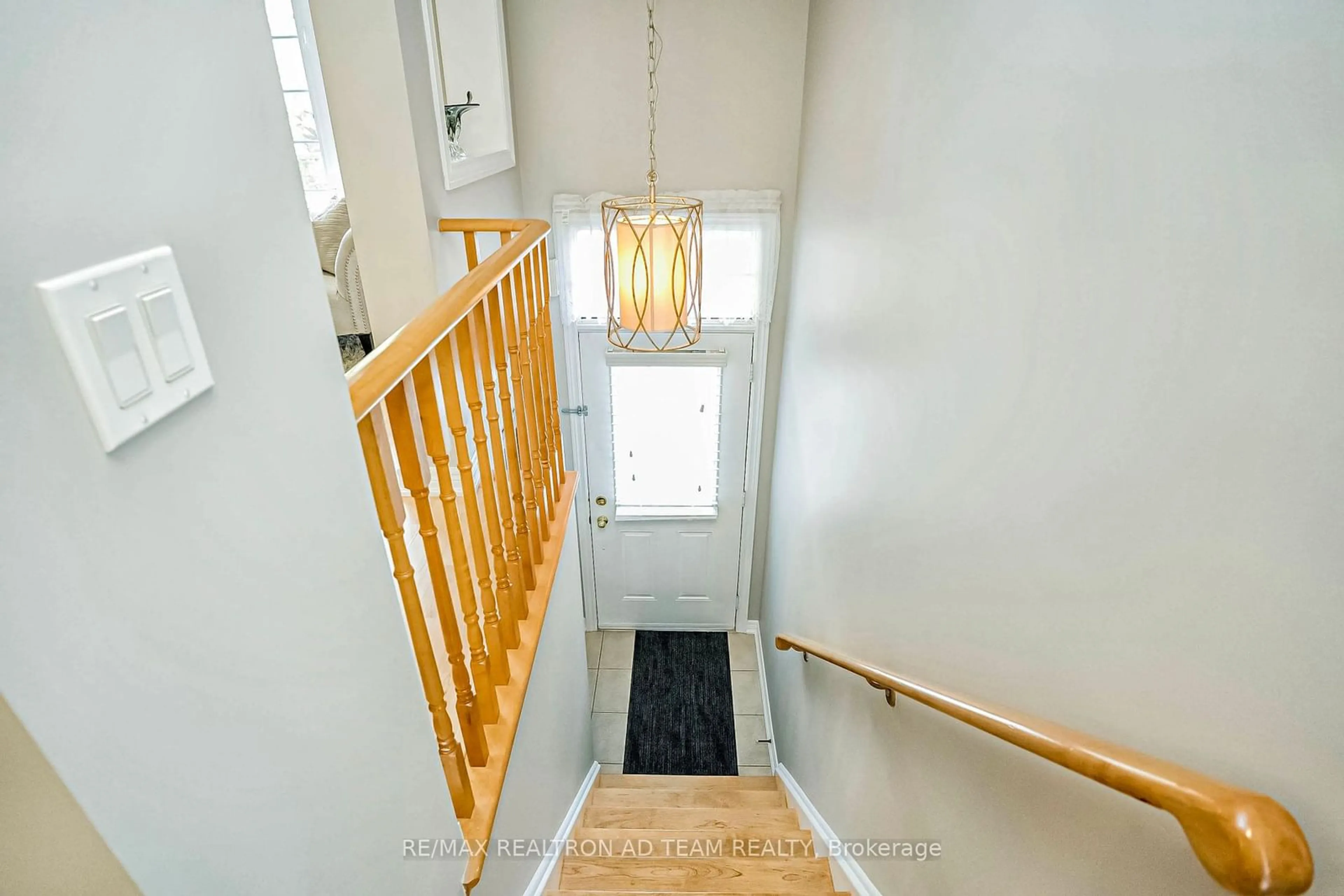 Indoor foyer, wood floors for 18 Oakins Lane, Ajax Ontario L1T 0H2