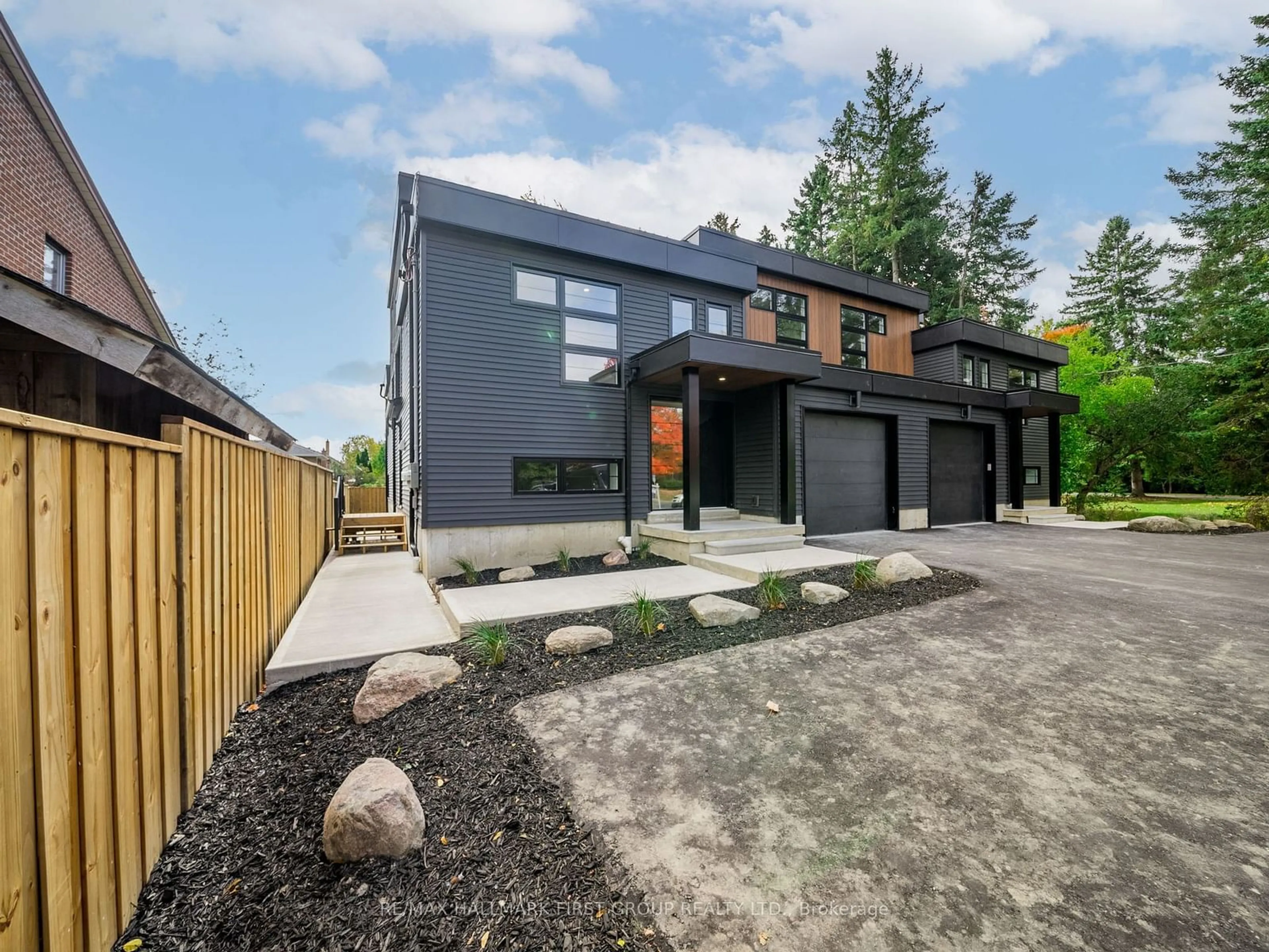 Frontside or backside of a home, the fenced backyard for 919 Dundas St, Whitby Ontario L1N 2N8