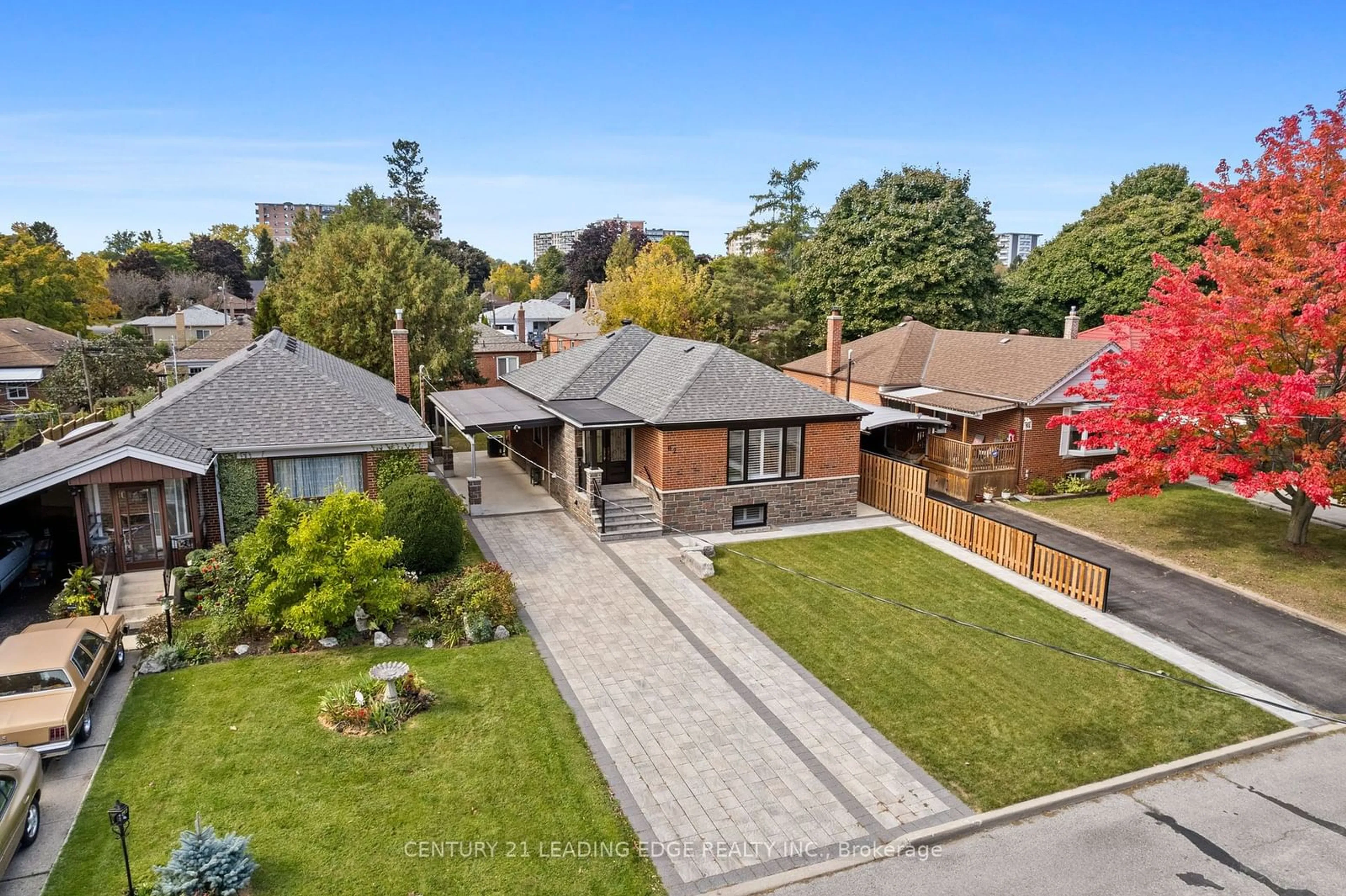 Frontside or backside of a home, the fenced backyard for 82 Lynvalley Cres, Toronto Ontario M1R 2V4