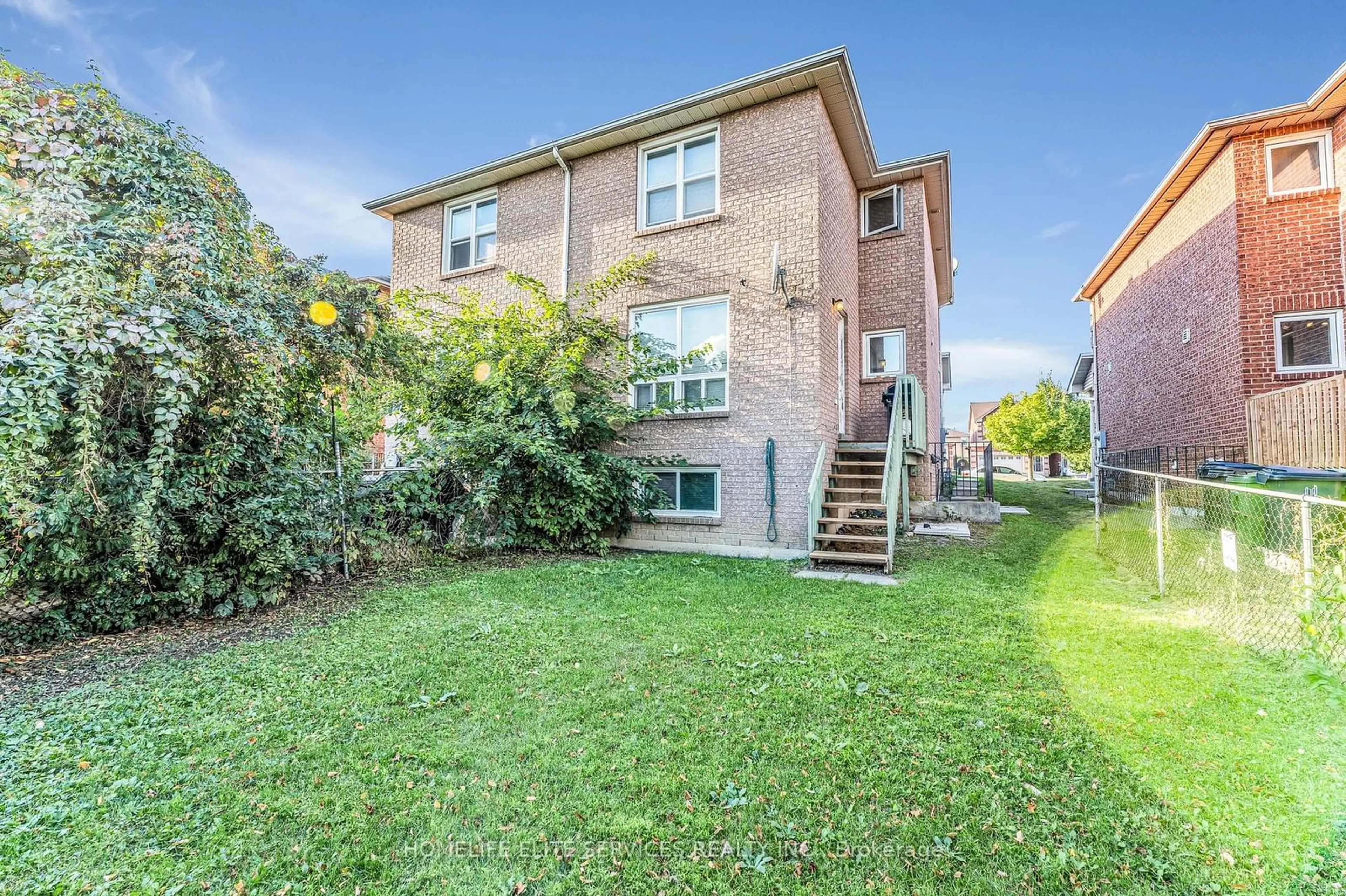 A pic from exterior of the house or condo, the fenced backyard for 9 Lenthall Ave, Toronto Ontario M1B 2C7