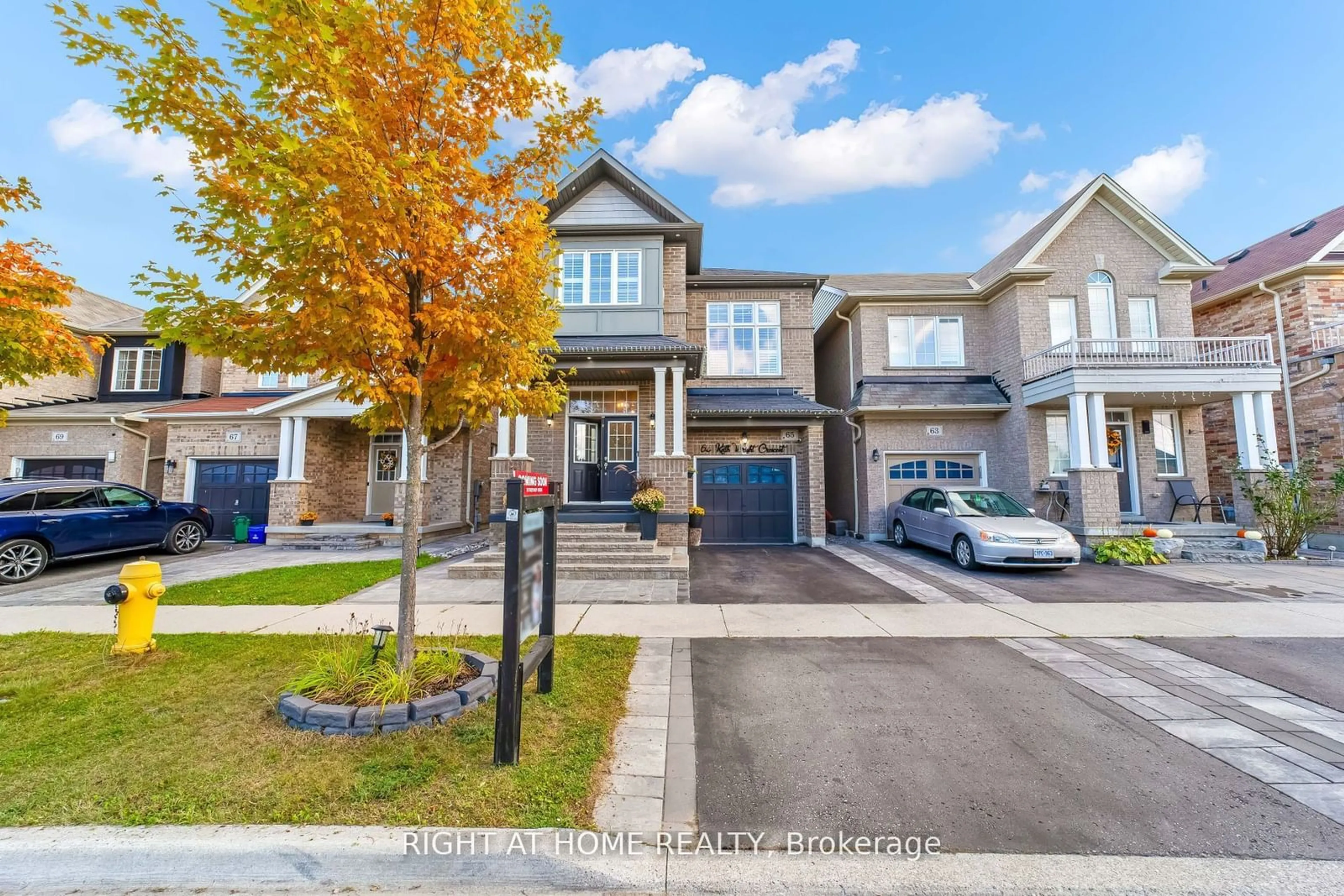 A pic from exterior of the house or condo, the street view for 65 KEITH WRIGHT Cres, Ajax Ontario L1Z 0P9