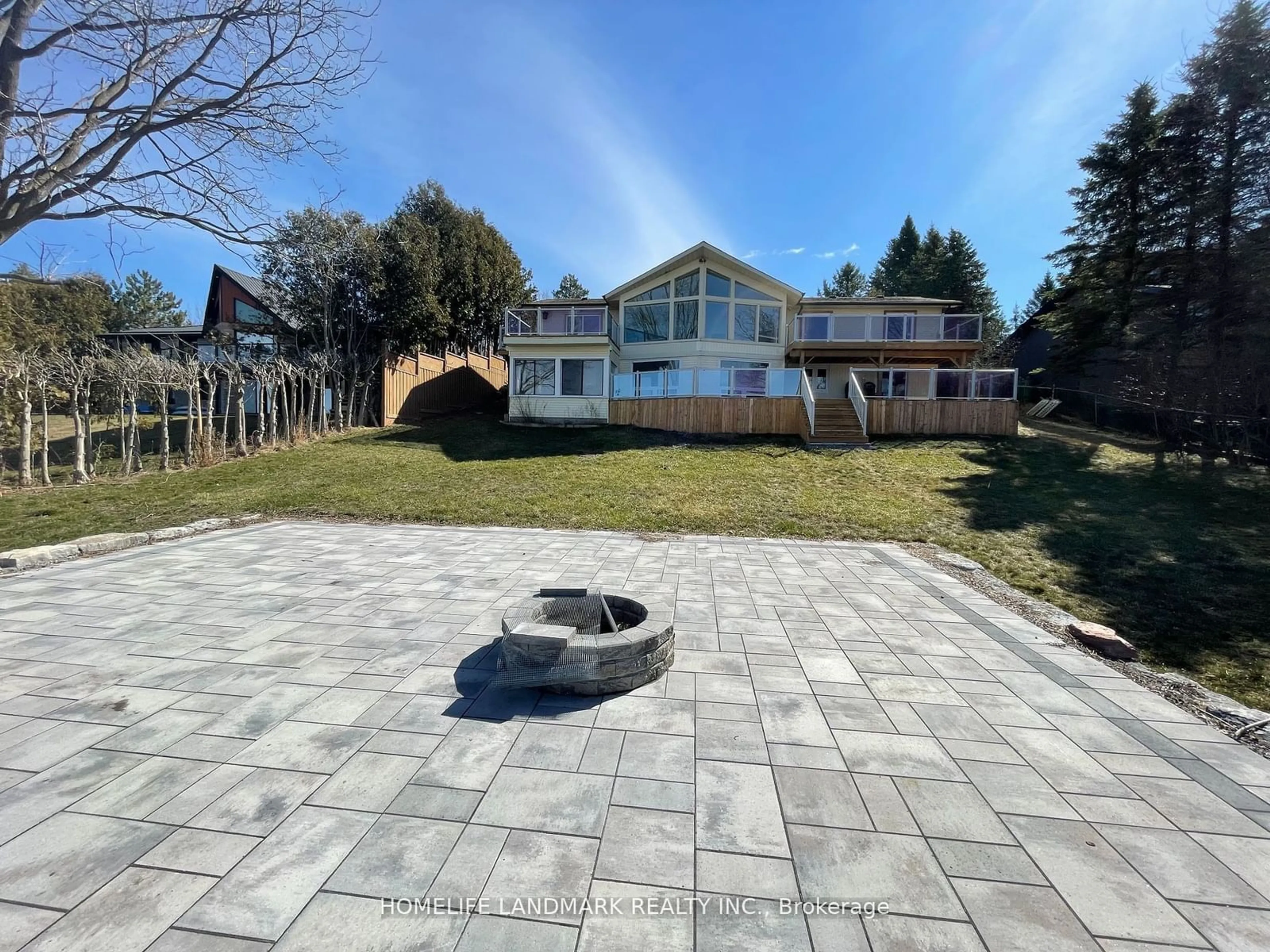 Frontside or backside of a home, the fenced backyard for 334 Fralick's Beach Rd, Scugog Ontario L9L 1B6