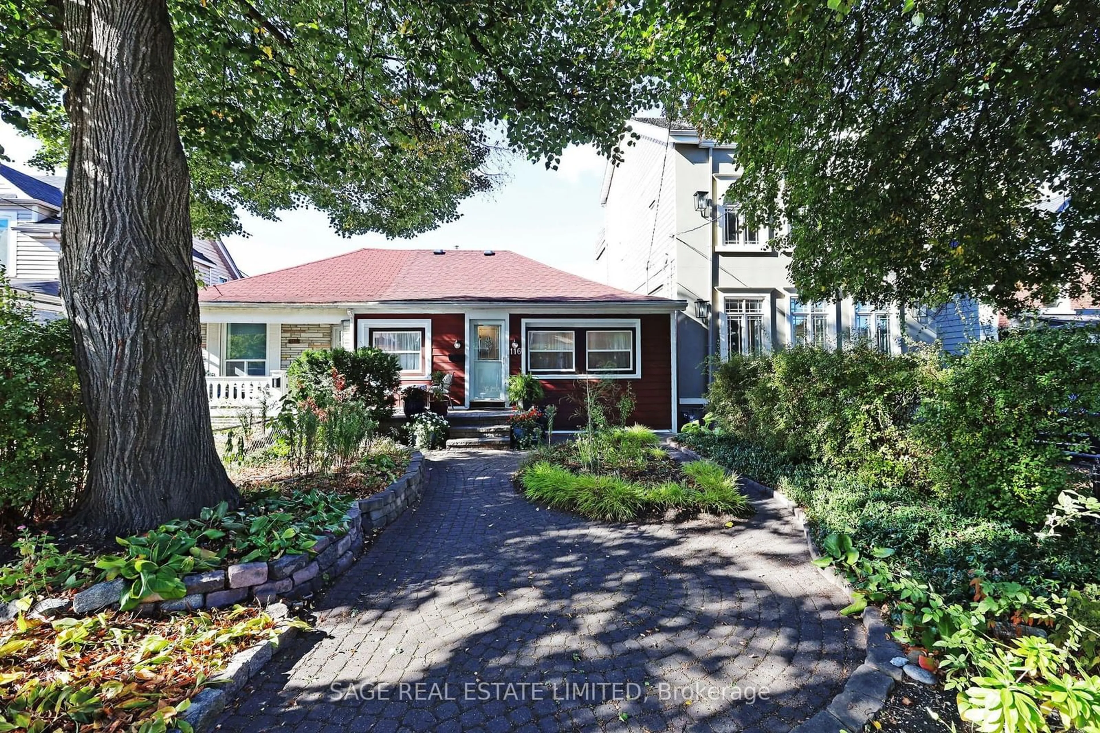 A pic from exterior of the house or condo, the street view for 116 Hannaford St, Toronto Ontario M4E 3H1