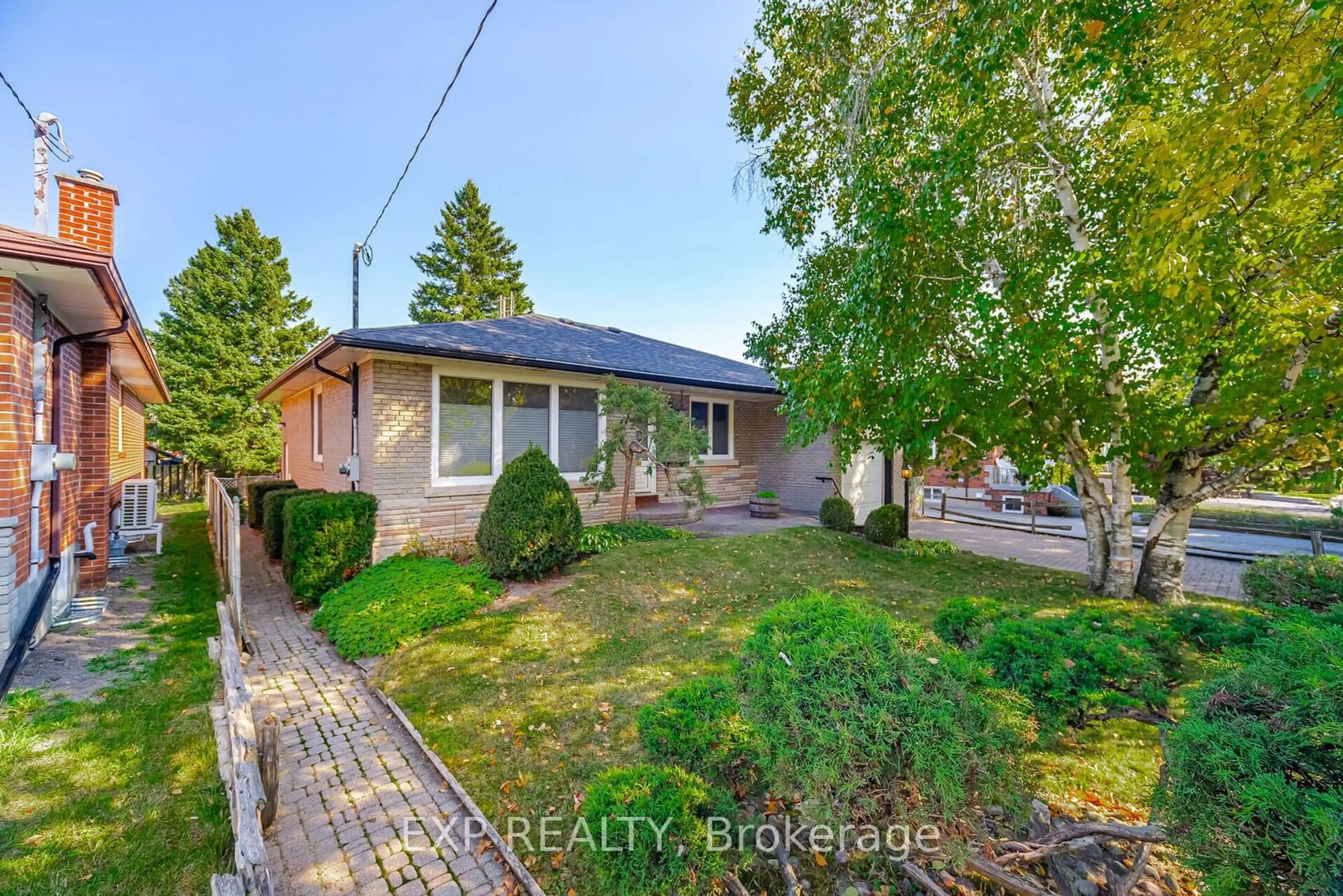 Frontside or backside of a home, the fenced backyard for 53 Sharbot Ave, Toronto Ontario M1H 1Z2