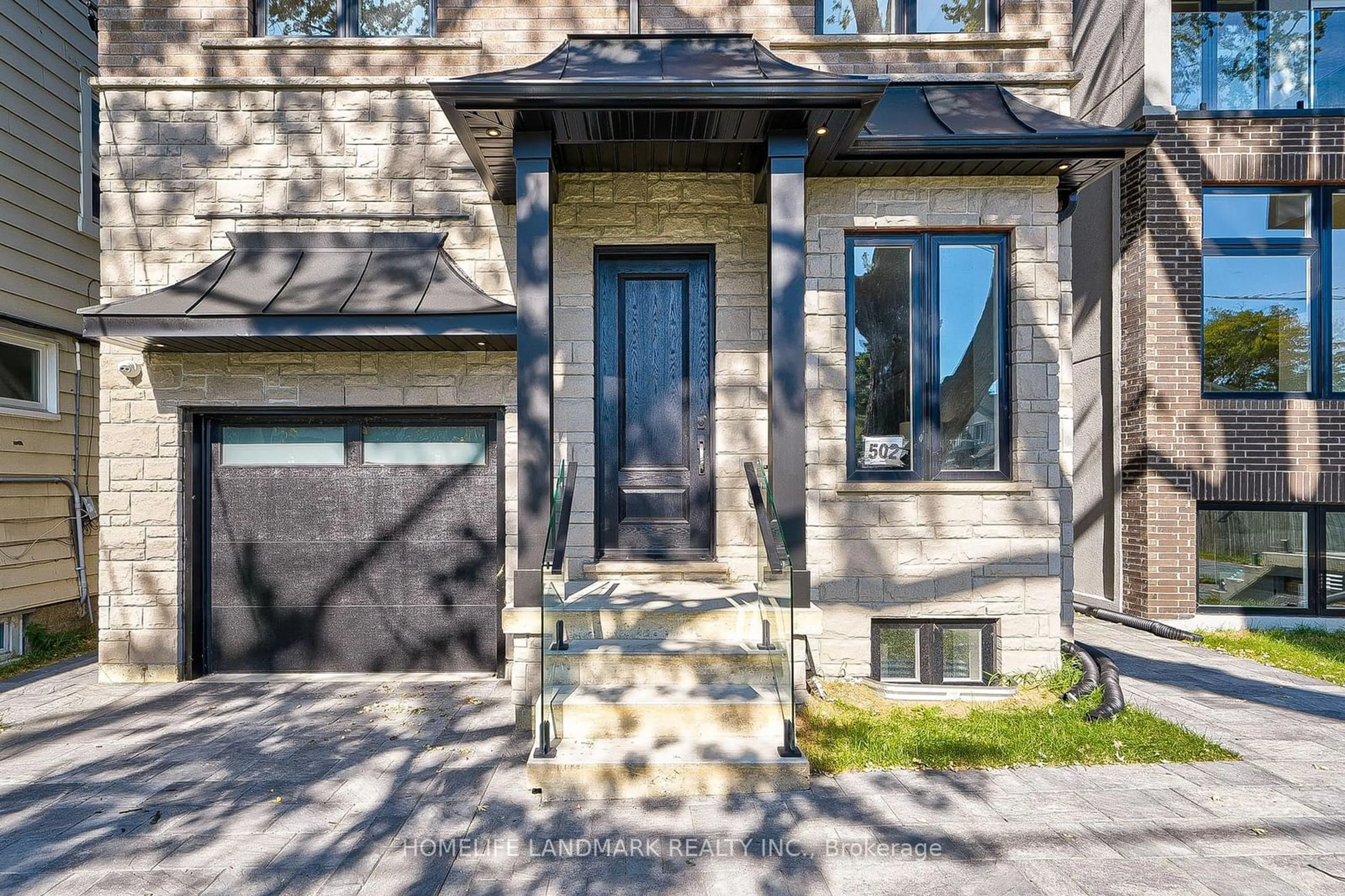 Home with brick exterior material for 502 Mortimer Ave, Toronto Ontario M4J 2G7