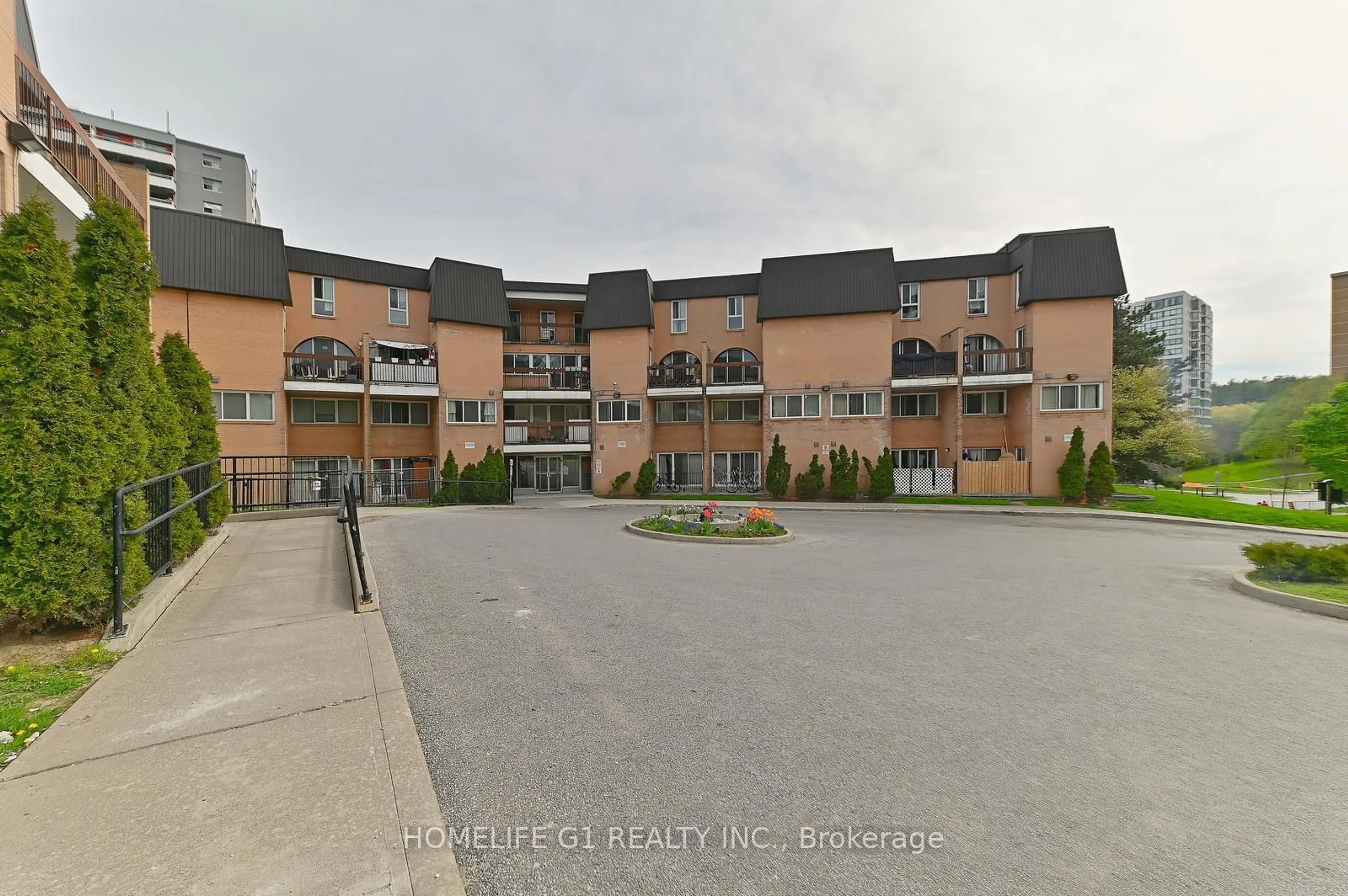 A pic from exterior of the house or condo, the street view for 100 Mornelle Crt #1039, Toronto Ontario M1E 4X2