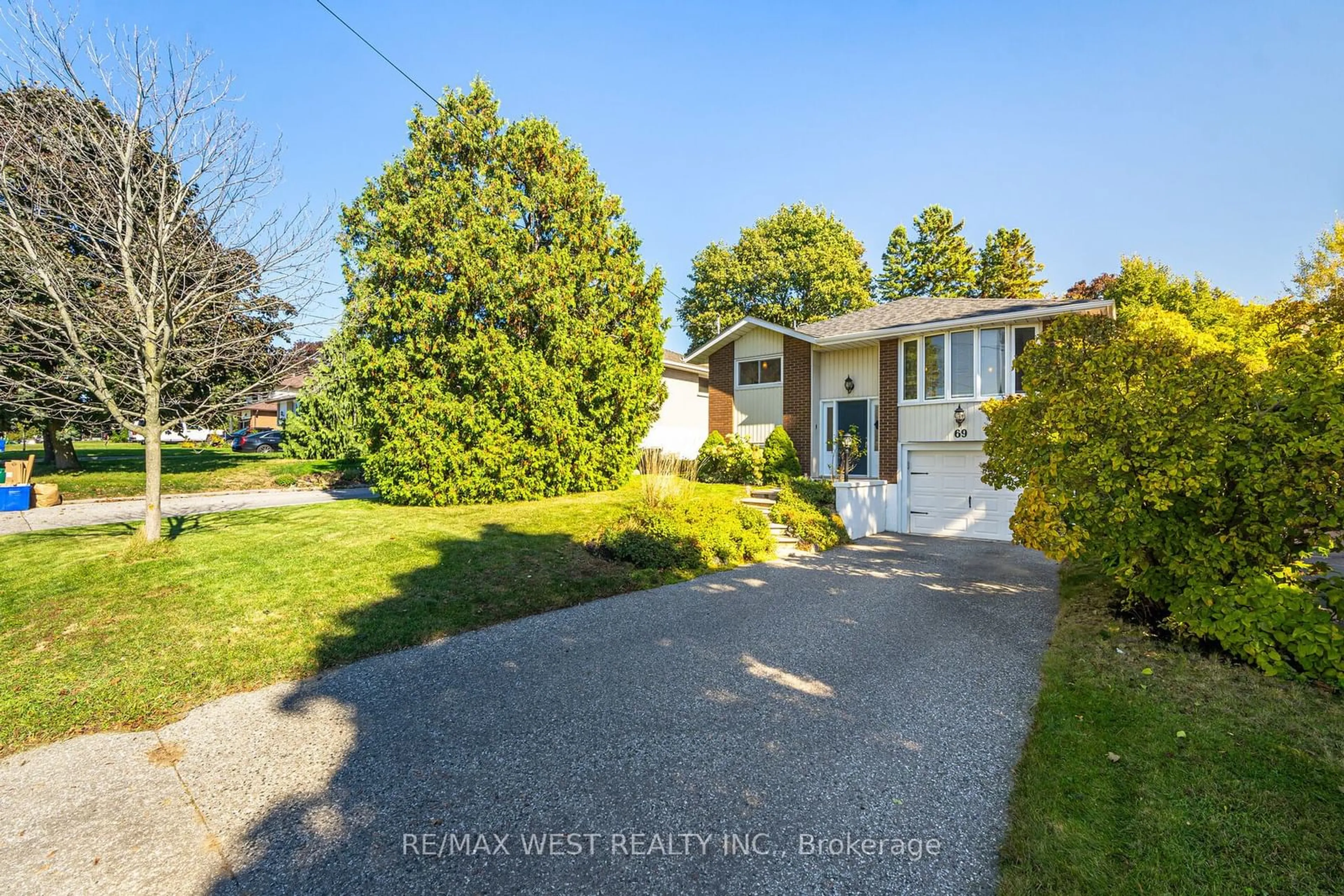 Frontside or backside of a home, the fenced backyard for 69 Keewatin St S, Oshawa Ontario L1H 6Z2