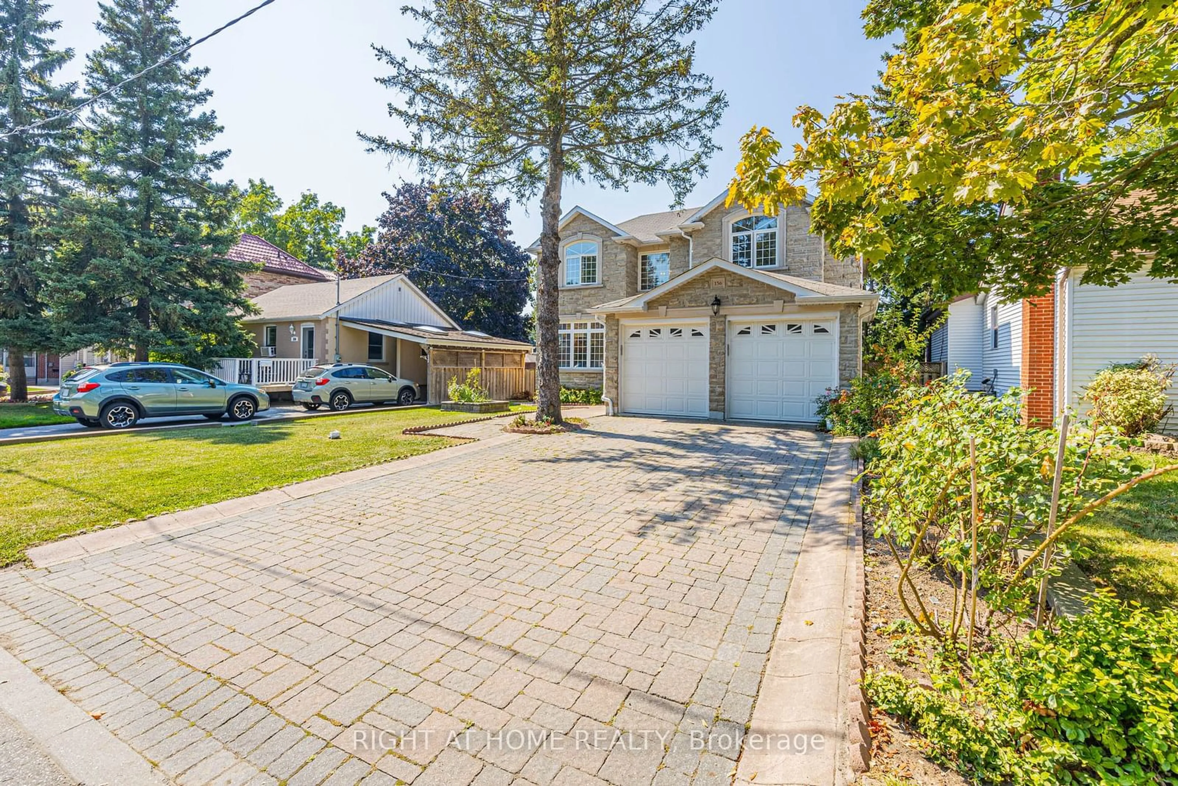 Frontside or backside of a home, the street view for 156 Harewood Ave, Toronto Ontario M1M 2R9