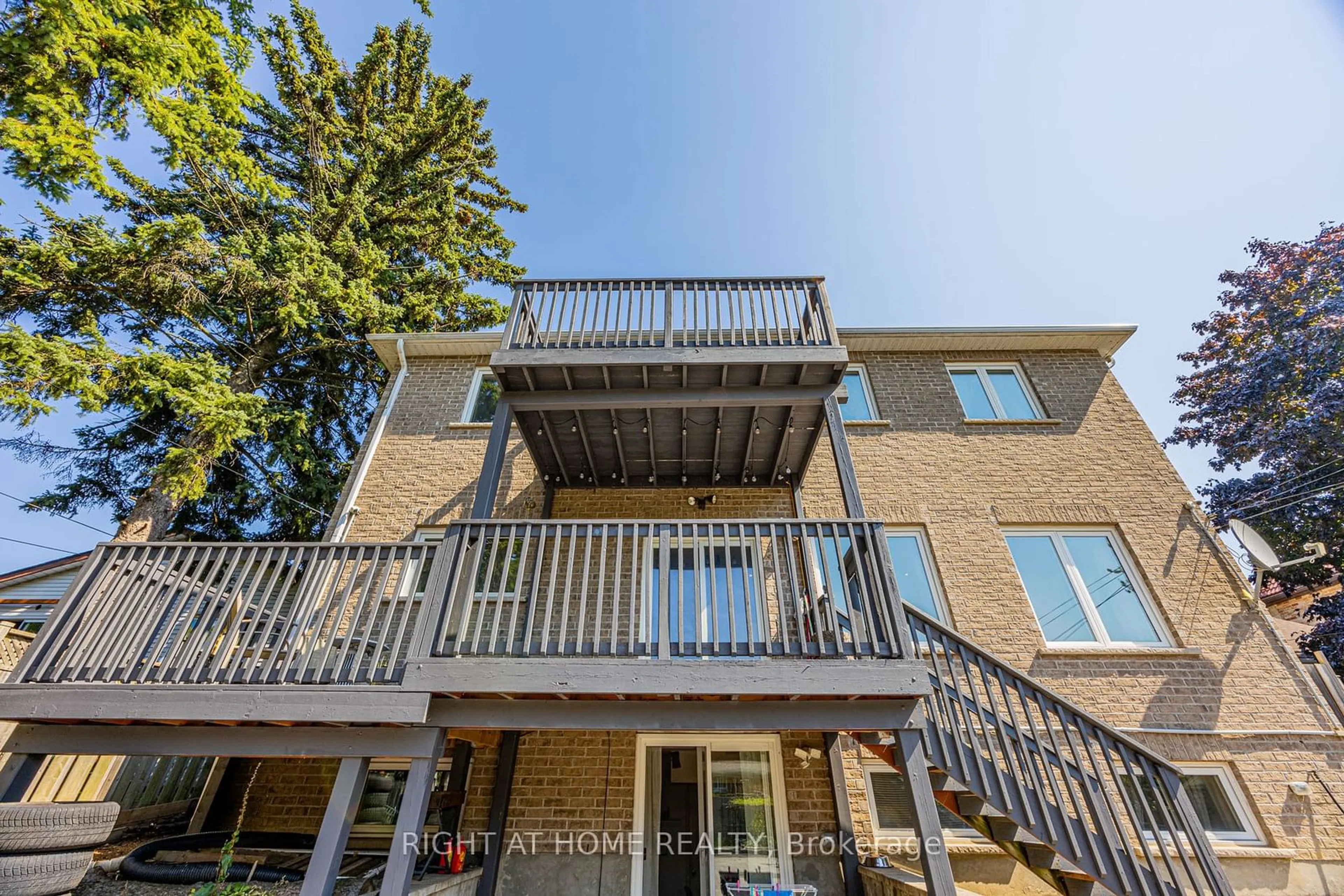 A pic from exterior of the house or condo, the fenced backyard for 156 Harewood Ave, Toronto Ontario M1M 2R9