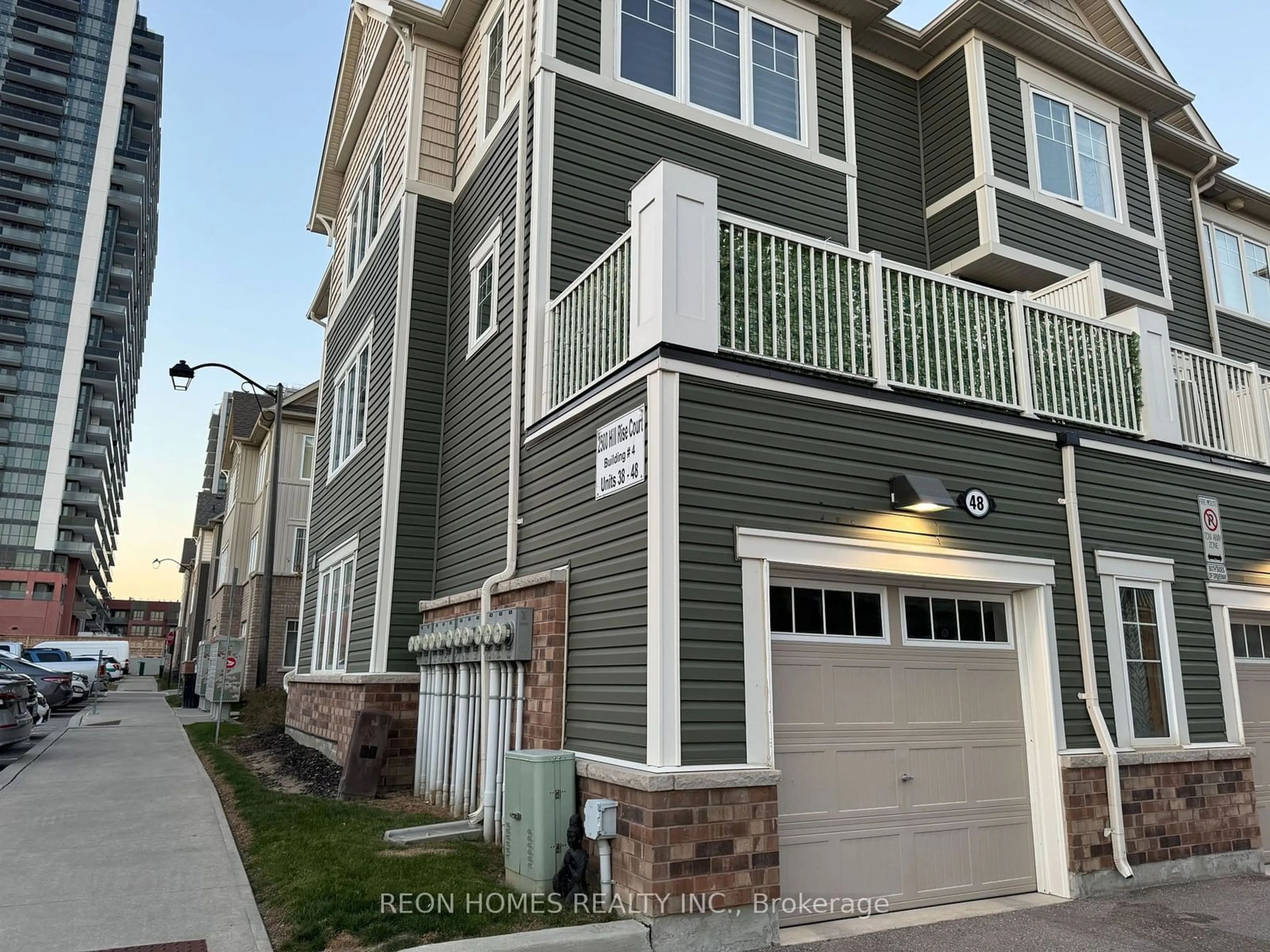 A pic from exterior of the house or condo, the street view for 2500 Hill Rise Crt #48, Oshawa Ontario L1L 0M6