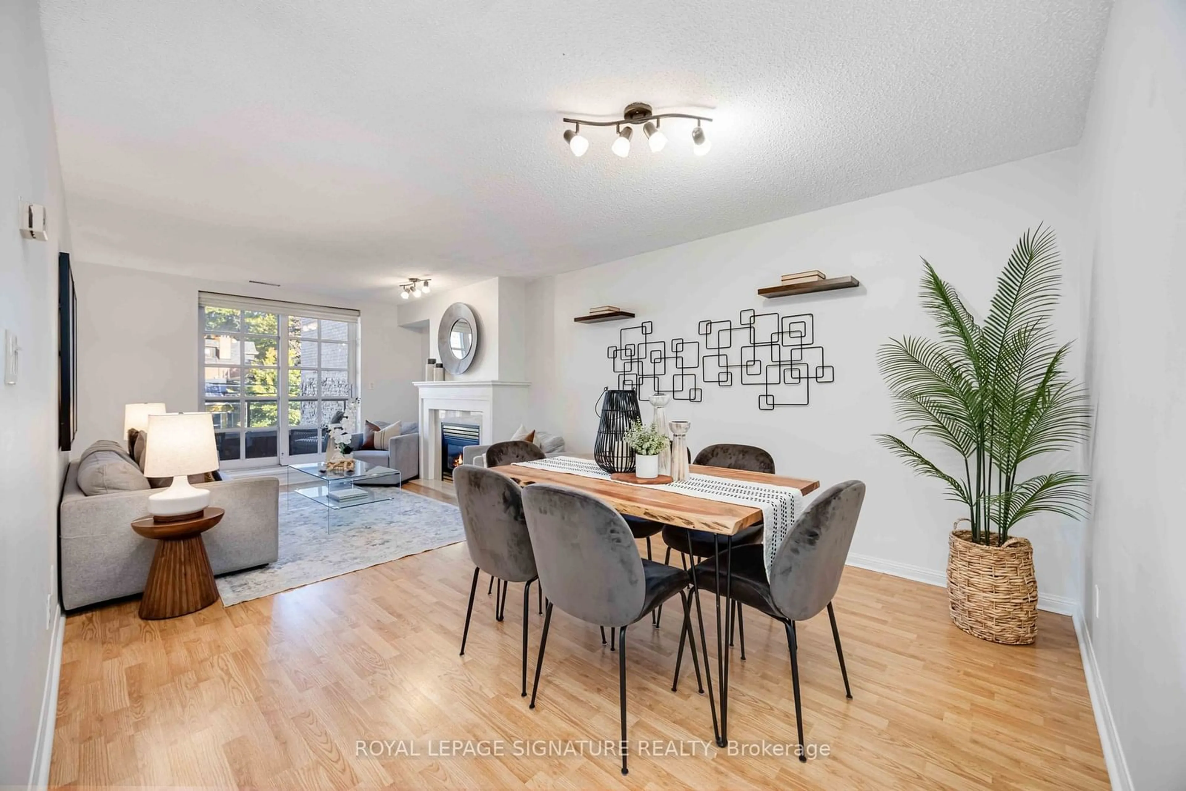 Dining room, wood floors for 2371 Queen St #301, Toronto Ontario M4E 1H2