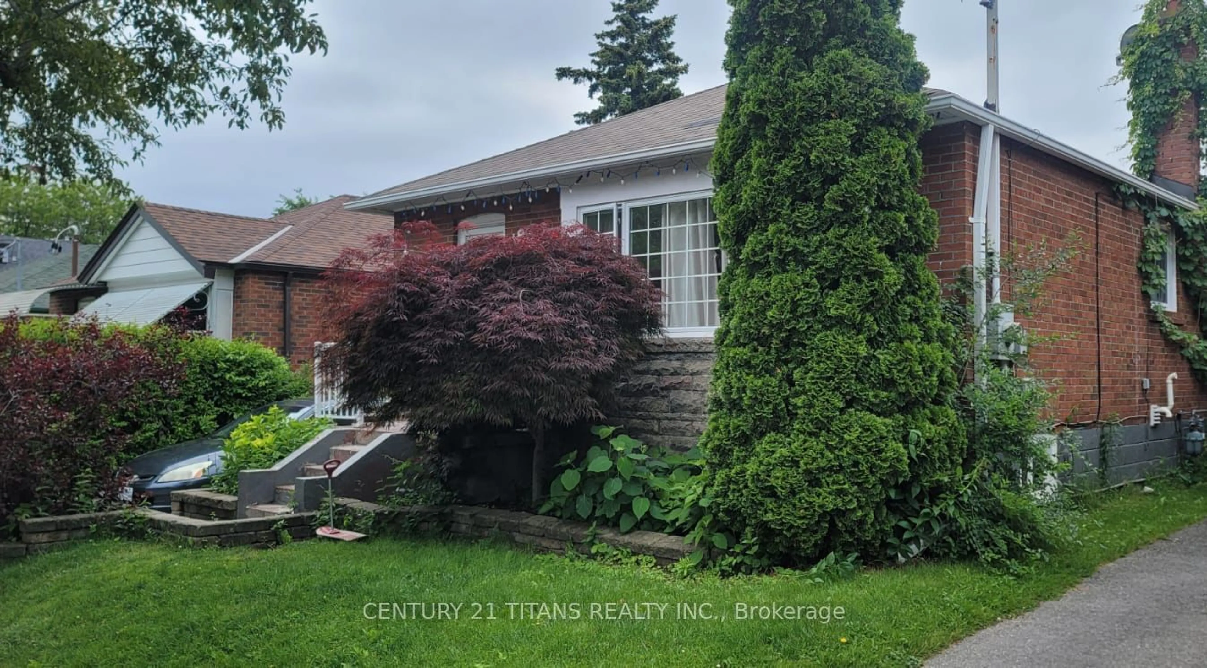 Frontside or backside of a home, the fenced backyard for 14 Anneke Rd, Toronto Ontario M1N 3M6