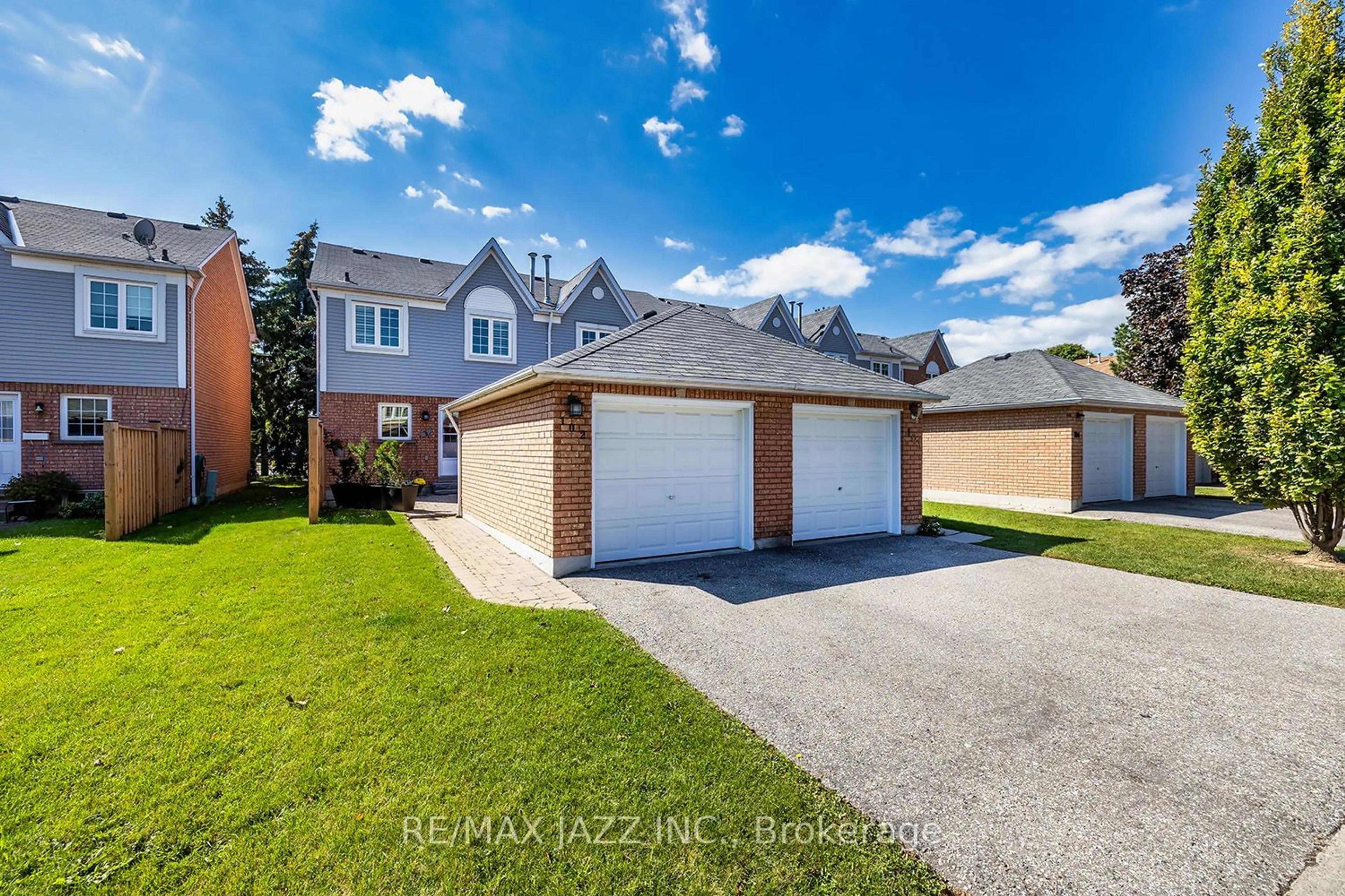 Frontside or backside of a home, the fenced backyard for 10 Bassett Blvd #102, Whitby Ontario L1N 9C5