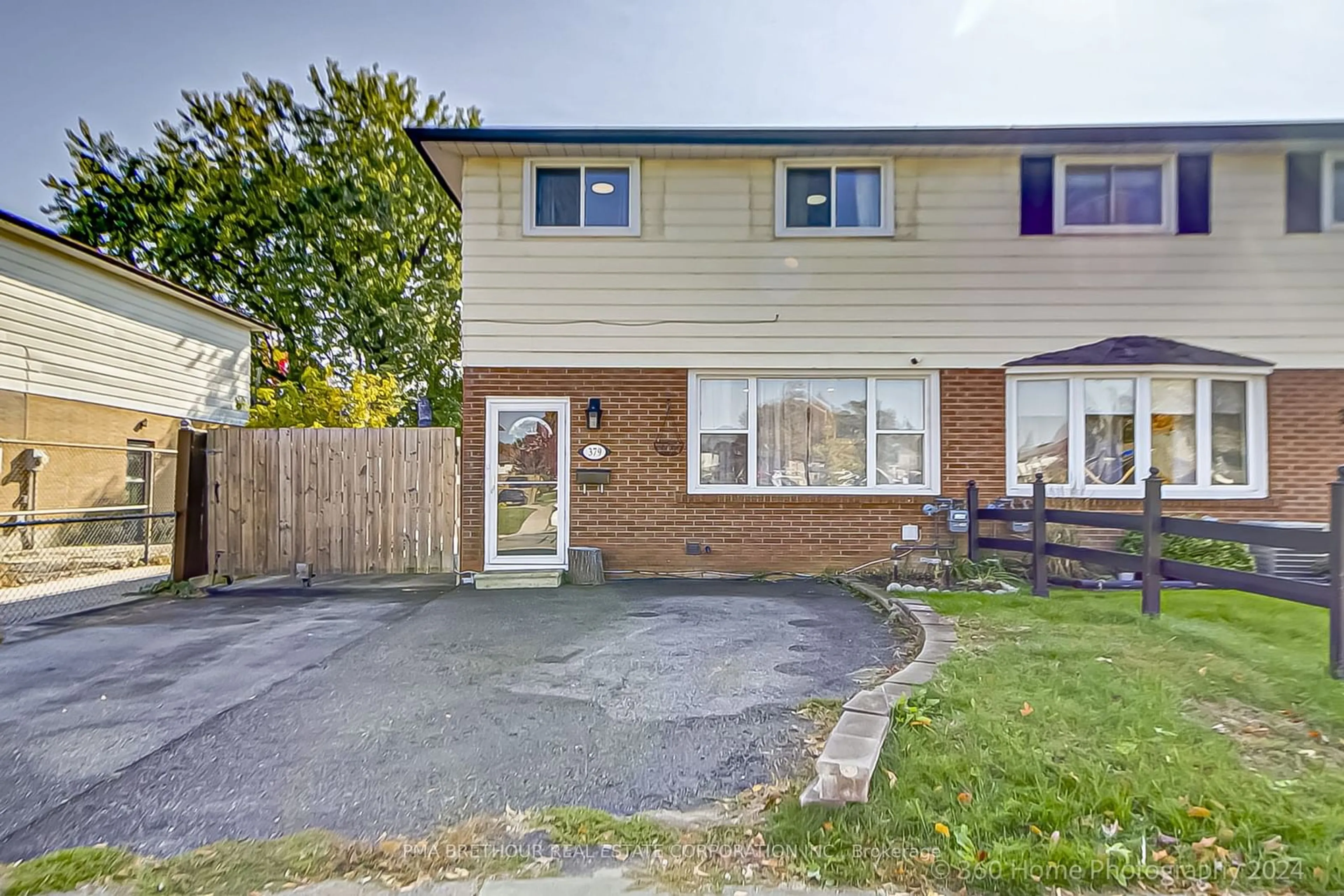 A pic from exterior of the house or condo, the fenced backyard for 379 Dwight Ave, Oshawa Ontario L1J 1K8