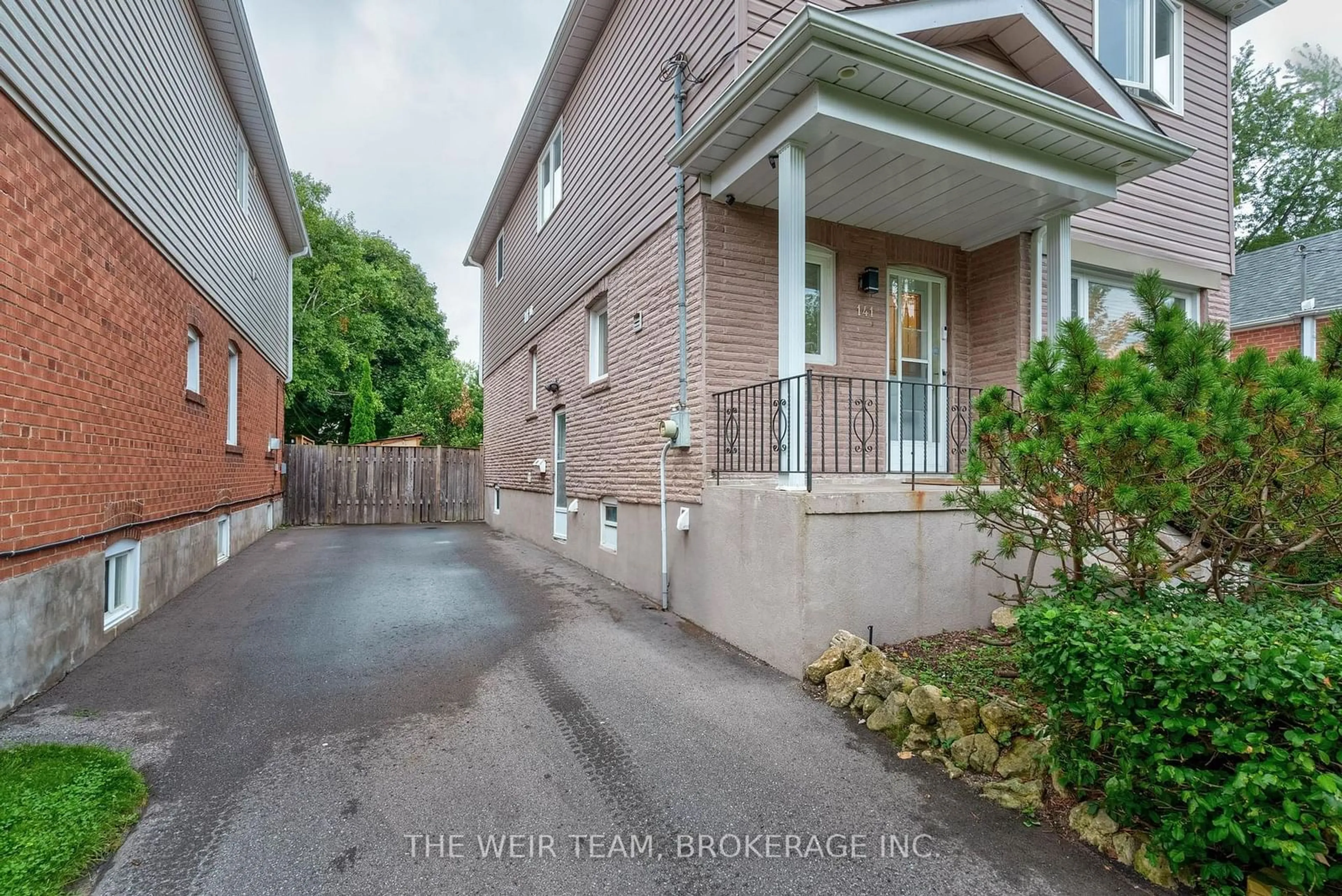 A pic from exterior of the house or condo, the street view for 141 Harewood Ave, Toronto Ontario M1M 2R8