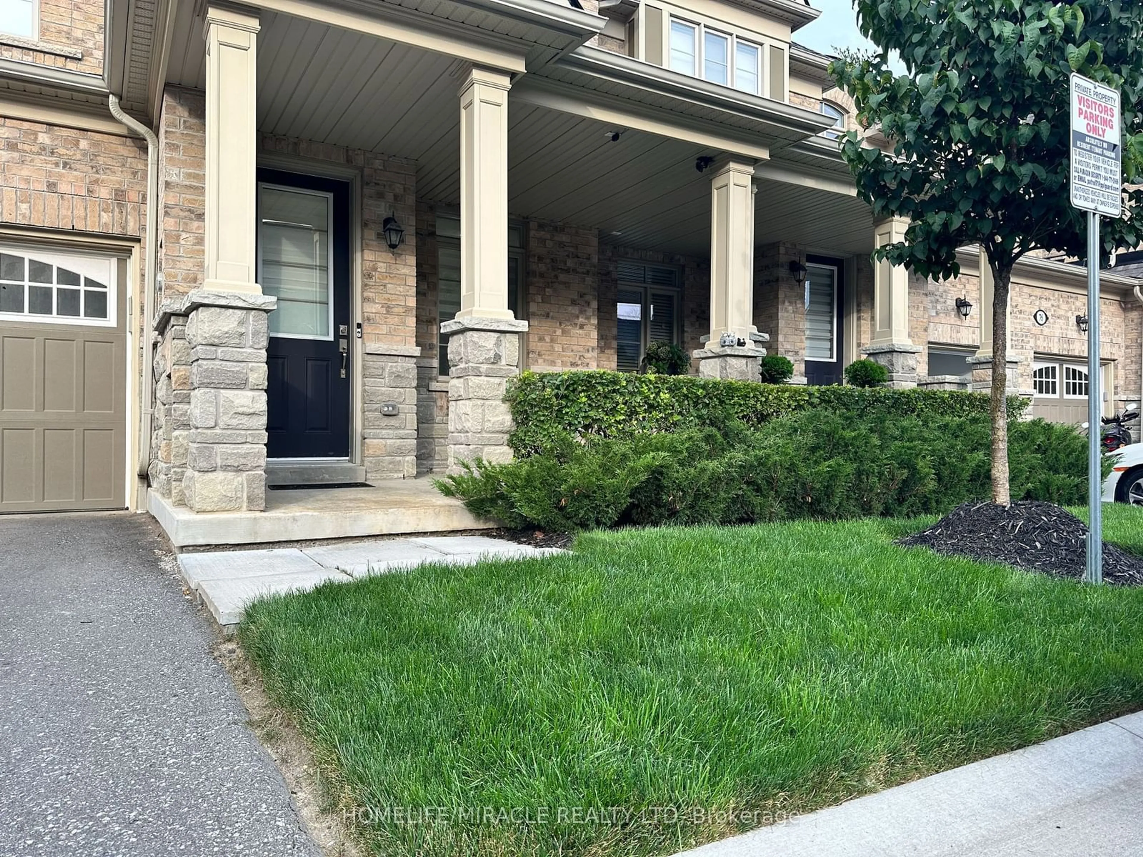 A pic from exterior of the house or condo, the street view for 80 Workmen's Circ, Ajax Ontario L1T 0N7